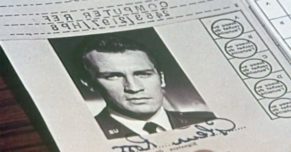 Reversed identification document from "Journey to the Far Side of the Sun" showing Glenn Ross on the mirror Earth.