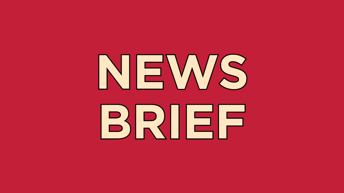 Yellow text on a red background: NEWS BRIEF.