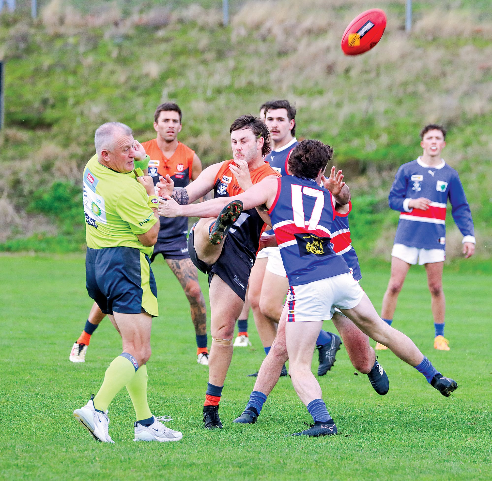 Korumburra Bena gets a quick kick away during a competitive opening to its match against Bunyip. A37_2224