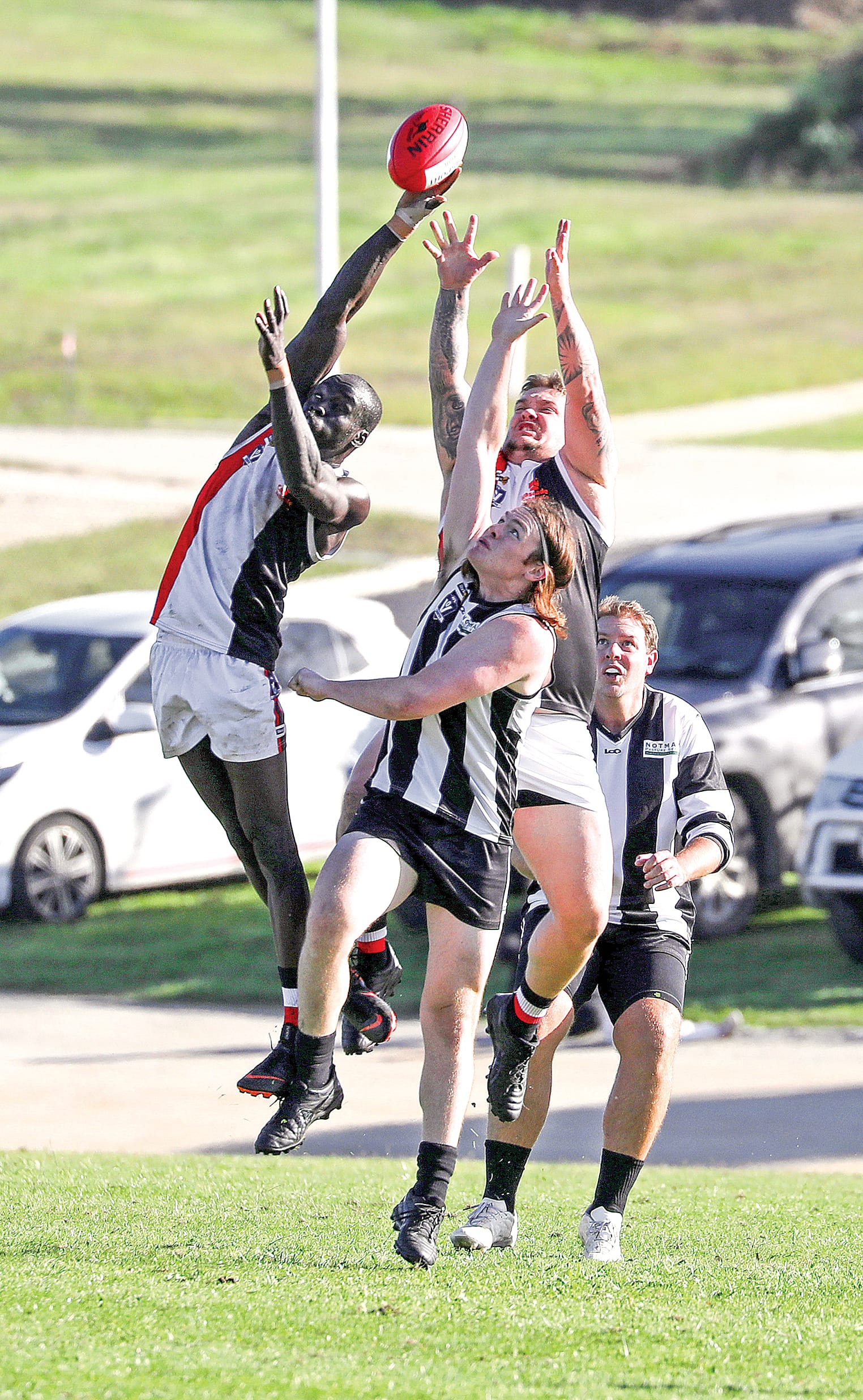 Nyora’s Santo Joma stretches for the footy during the Saints’ clash with Poowong. Photos: Jeff Tull