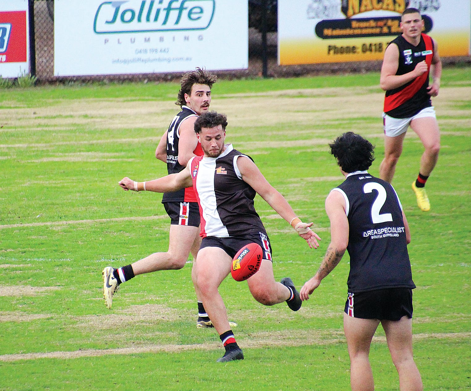 Tane White sinks his boot into the Sherrin.