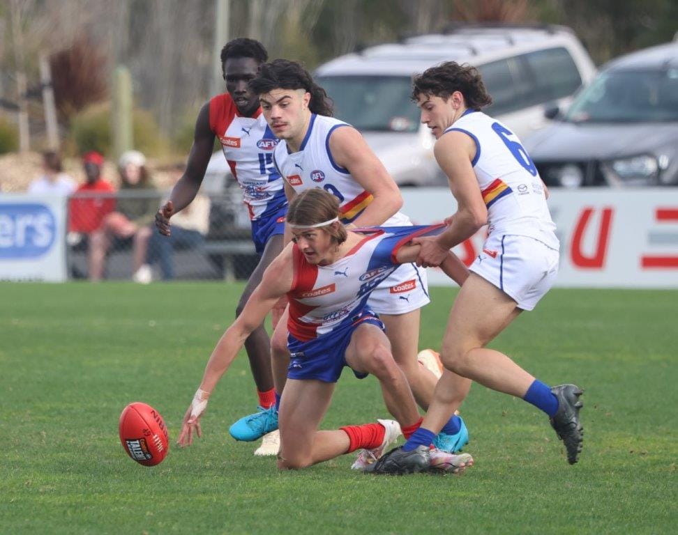 In the thick of it against Eastern Rangers is Gippsland Power's Jobe Scapin.