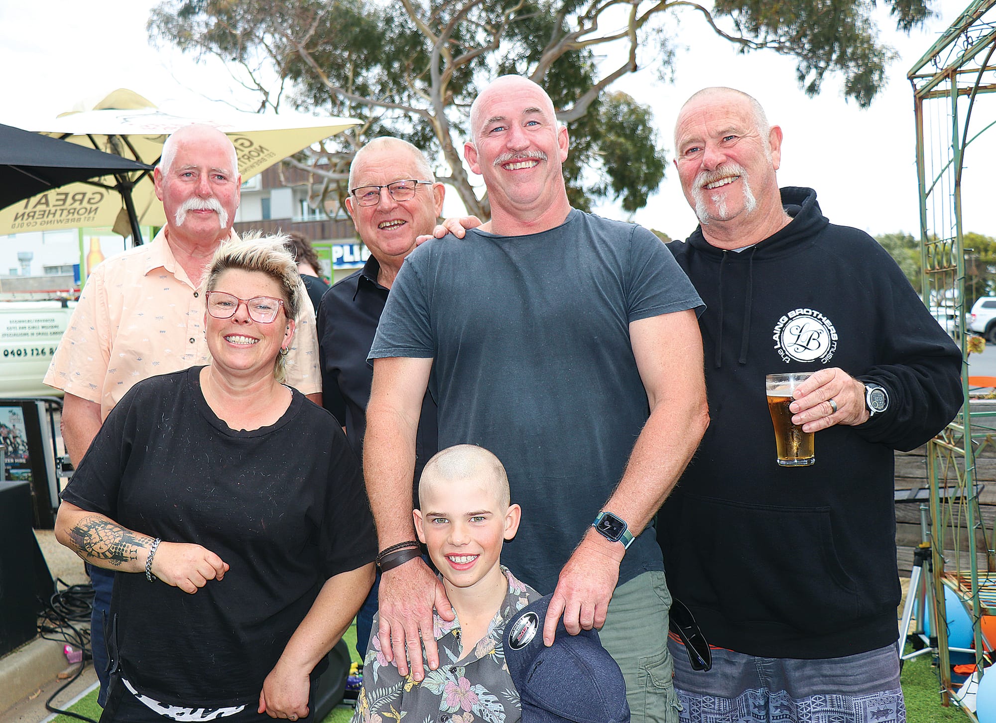 Owner of Beachside Hair and Beauty, Kim donated her time shaving the heads of Jack, Uncle Mal, Kirk, Ian, Byron, and Sean (not pictured) raising $11,774.05 for blood cancer. Z22_4822 