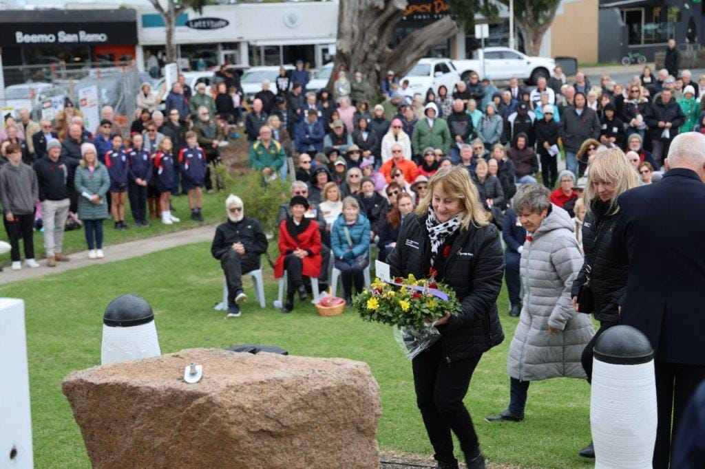 Representatives of the Bendigo Bank in San Remo lay a wreath on Anzac Day.