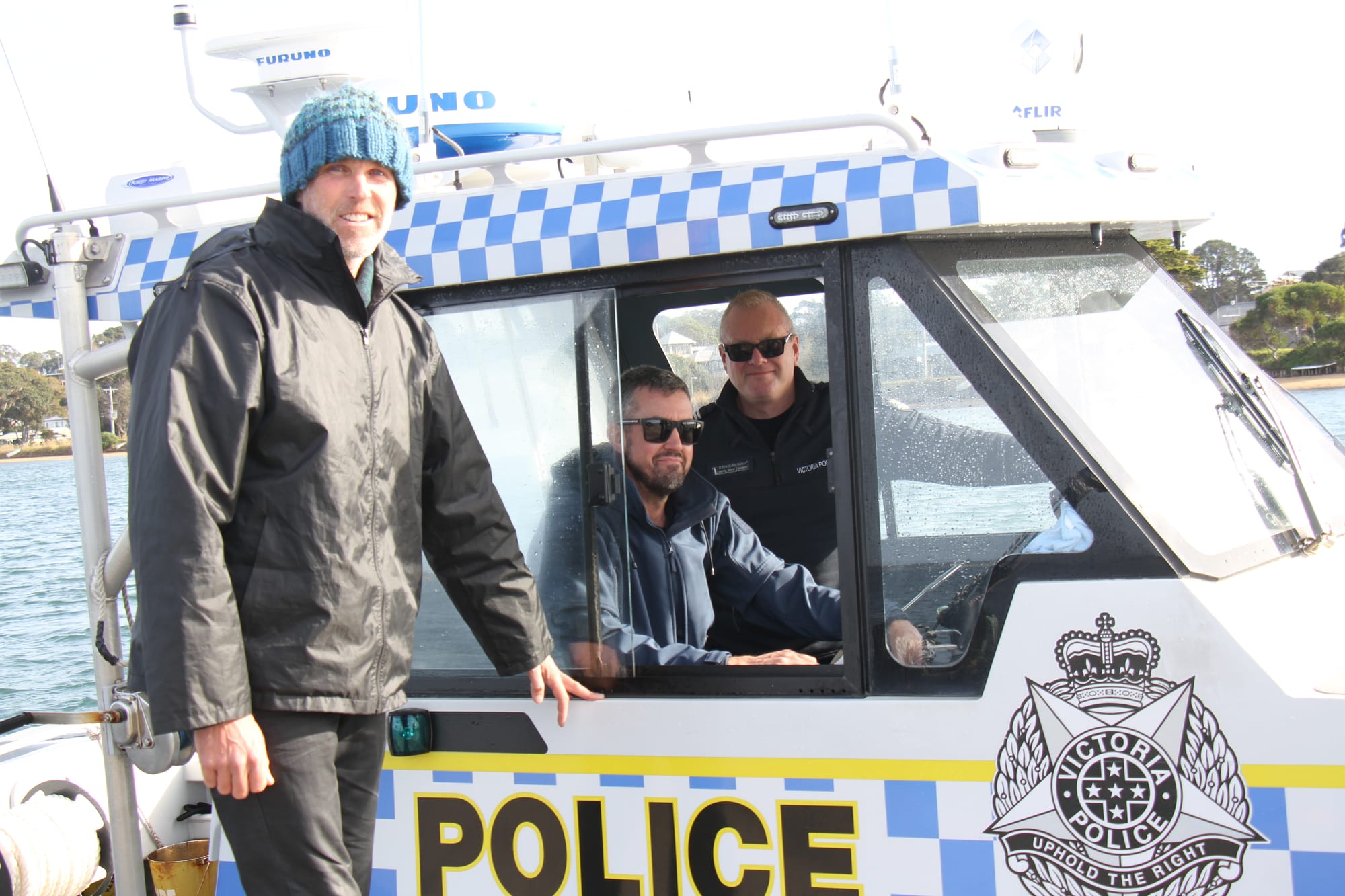 Samuel McLennan checking local sailing conditions on Western Port Bay with Snr. Constable Joe Lynas and Leading Snr. Constable Wayne Evans Barker from Hastings Water Police. B32_2825