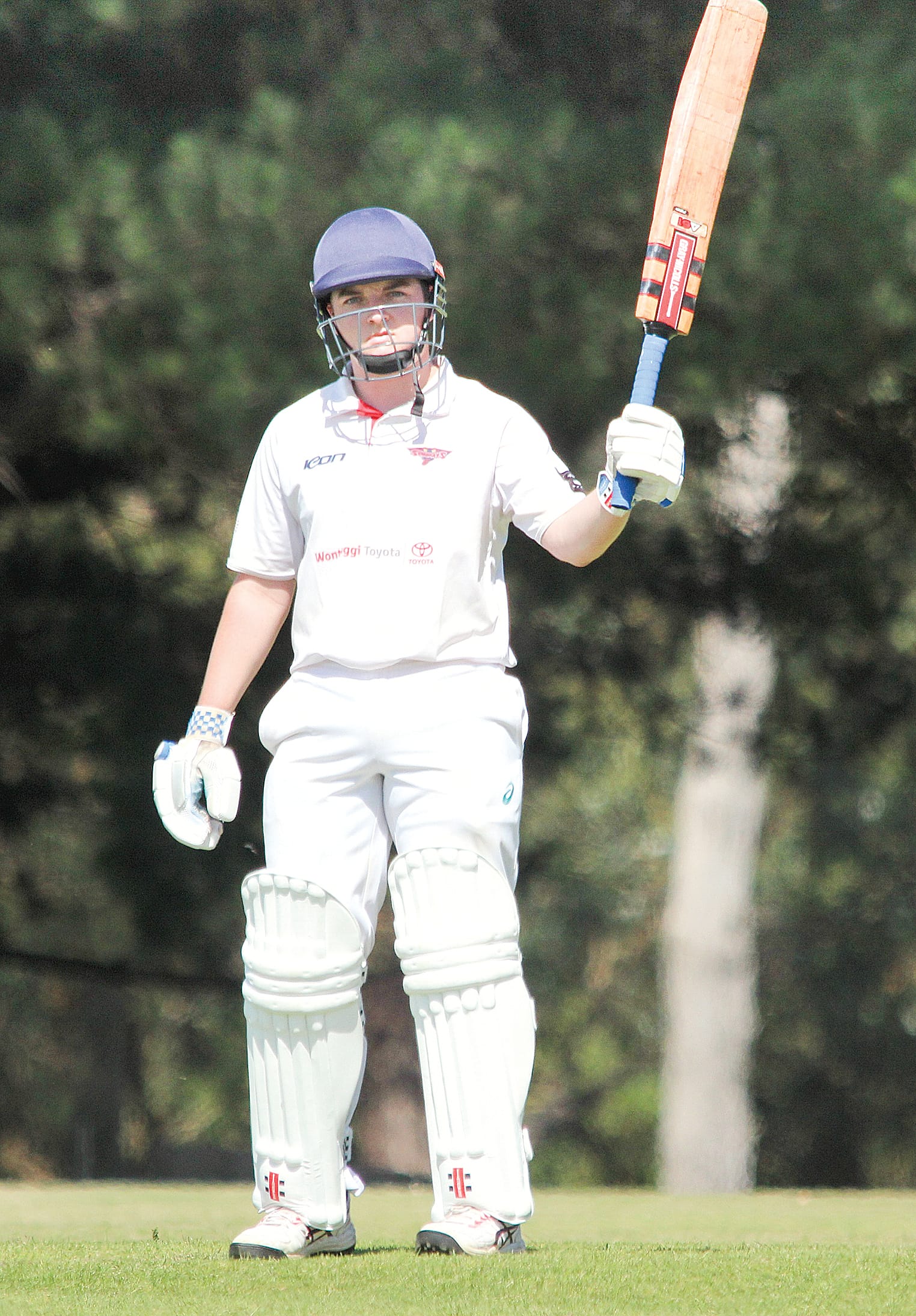 Stingrays number six Jake Dennerley raises his bat towards his teammates after reaching the half-century mark at Nerrena. 
