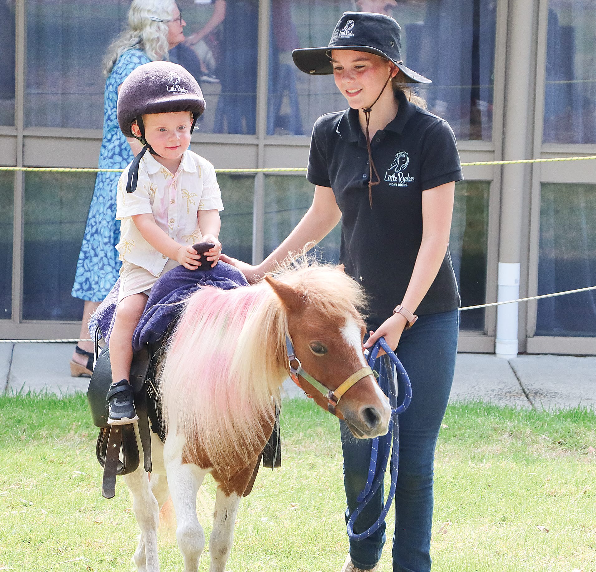 Harry Stevens enjoying a pony ride on the friendly pony Louie. Led by Zoe Ledgar. W44_1025