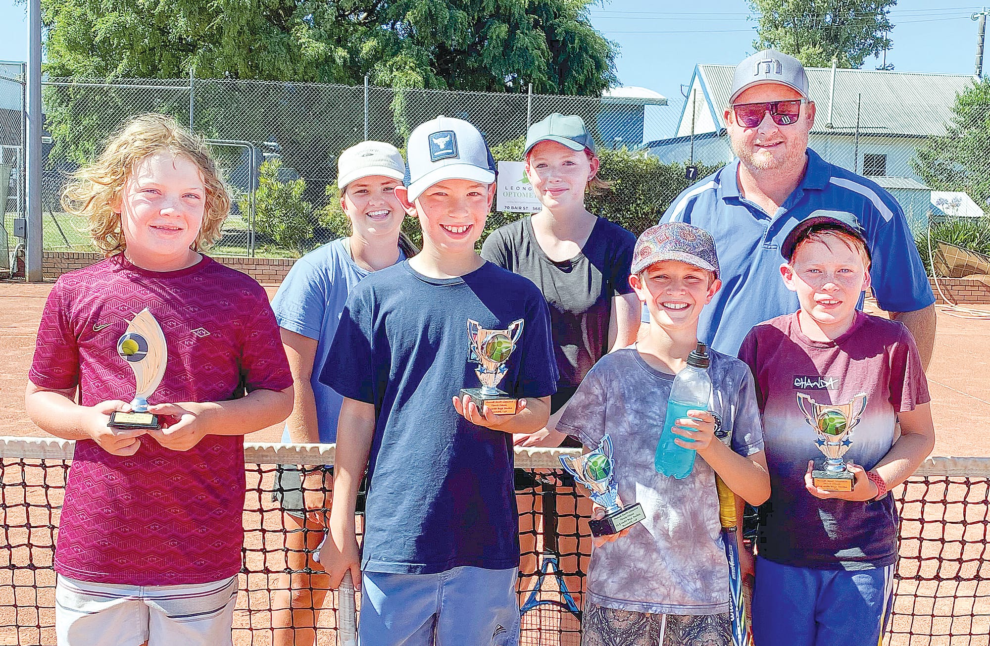 Tennis Camp attendees, front: Archer Commadeur, Hudson Clasby, Ryan Perry and Declan Russell. Back: Ella Skelton, Mila Cocks and coach Matthew Pocklington.