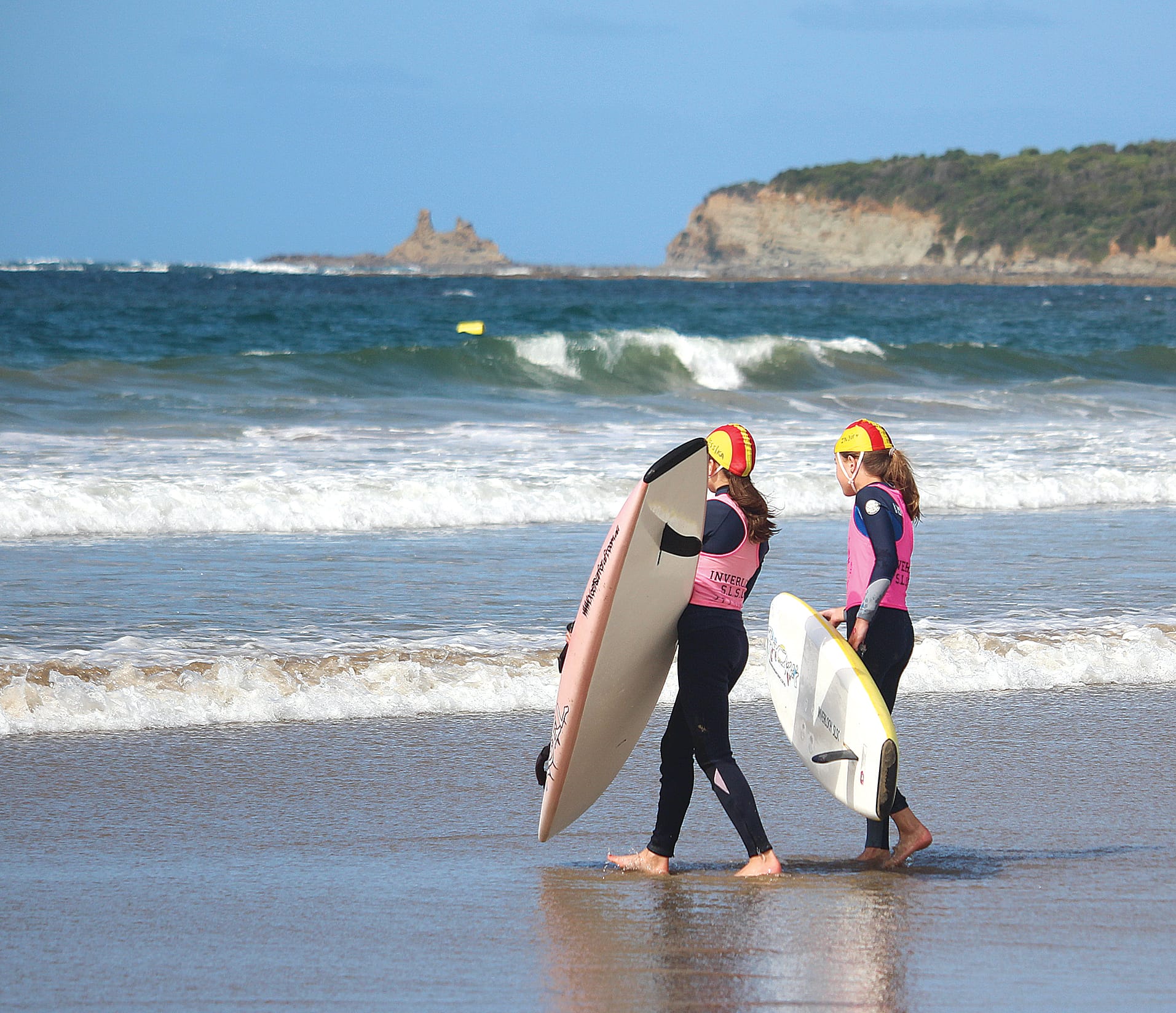 Two keen nippers head into the water with their boards. B05_0123