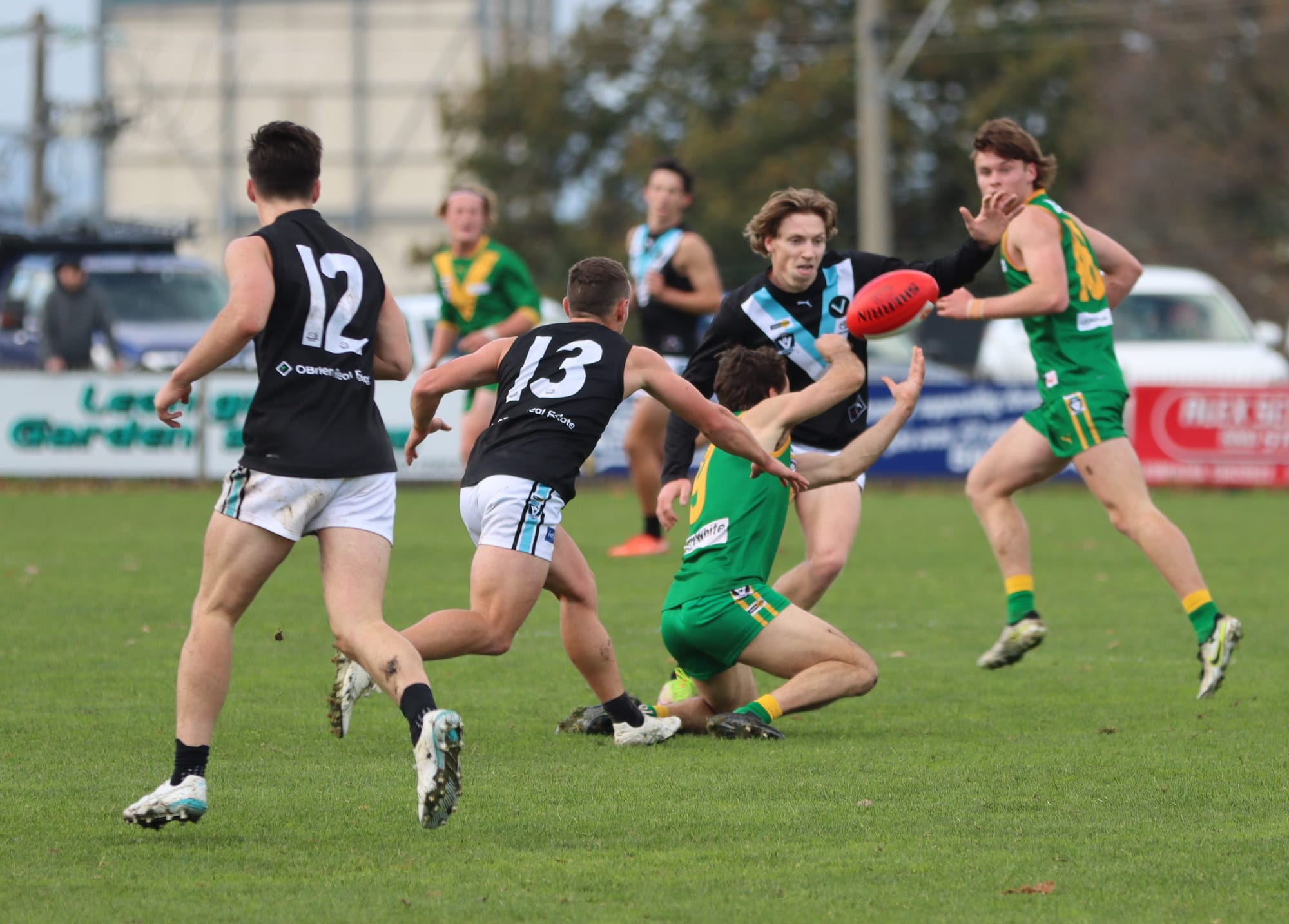 Wonthaggi's Isaac Chugg comes in to block a Nick Argento handball as the Parrots ran riot after quarter time.