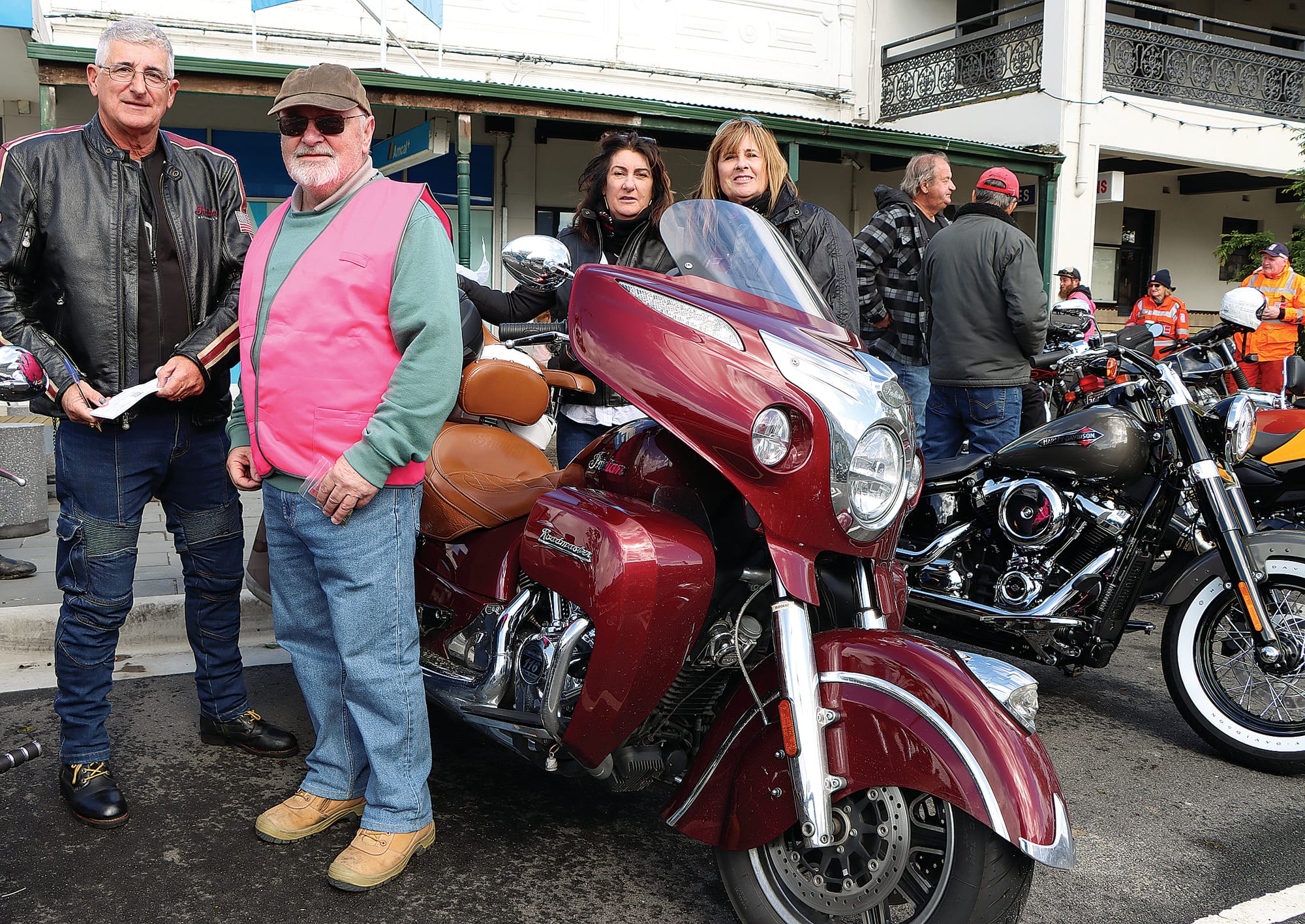 Brent Robinson enters the Biketoberfest raffle, with volunteer Ken Wanklyn selling tickets. &nbsp;Robyn Robinson and Eva De Rango are behind the stunning Roadmaster motorcycle.

