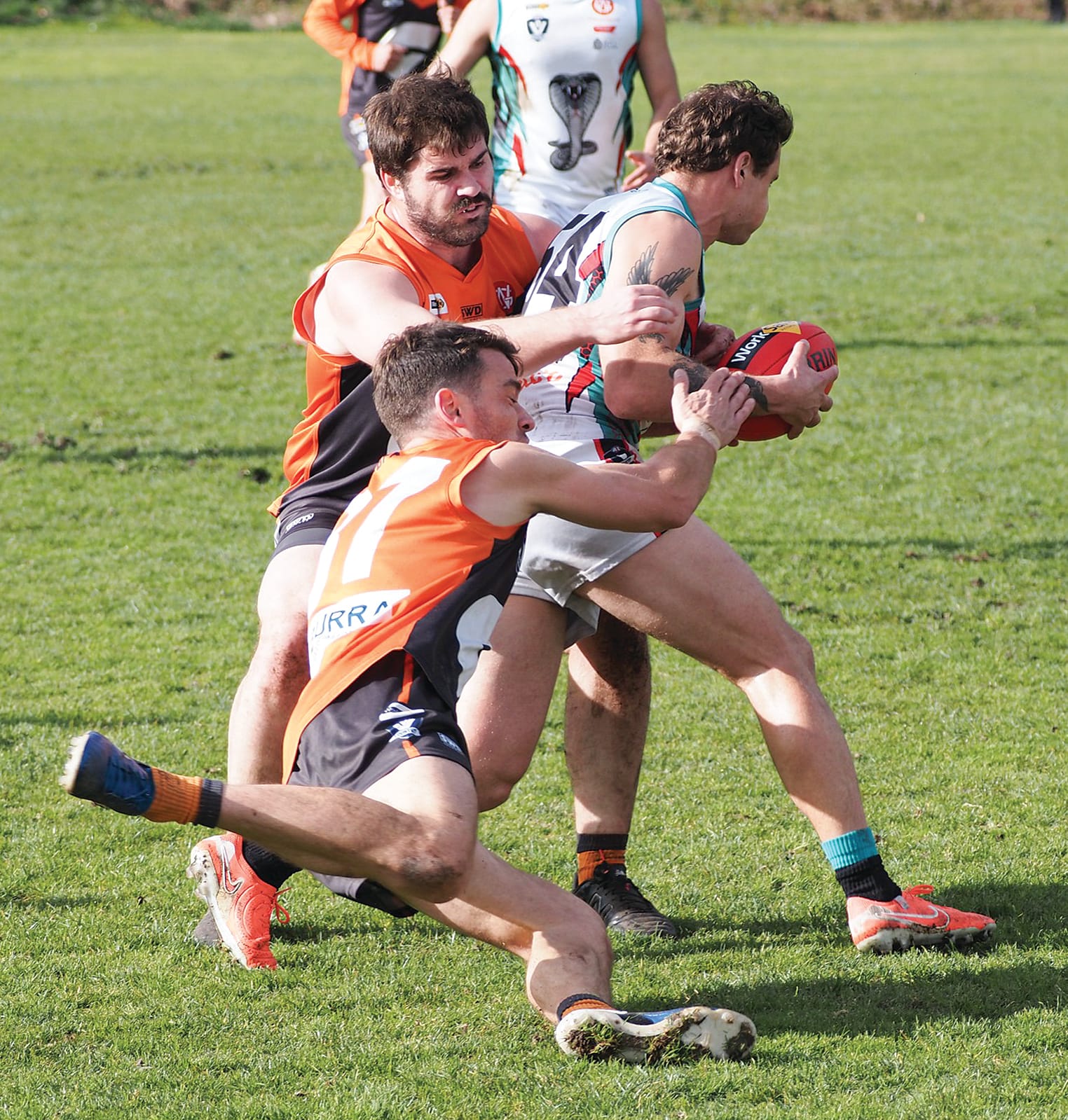 Jordi Ceppi dive tackles his Cora Lynn opponent. Photos: Rob Gardiner