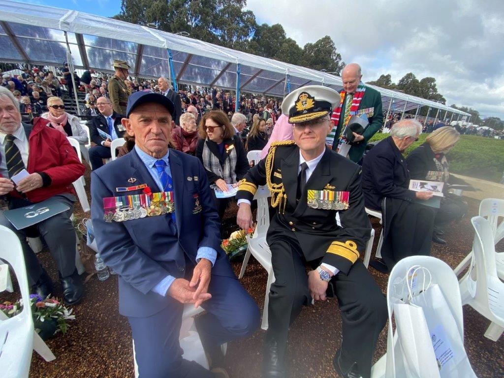 Son of Vietnam War Victoria Cross recipient Kevin Arthur 'Dasher' Wheatley of Sydney, George Weatley chats with Rear Admiral David Mann at today's service in Canberra.