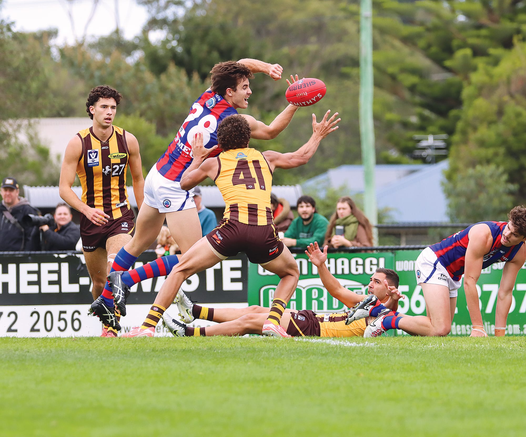 Thomas Graham of Port Melbourne and Box Hill’s Matthew Hill compete near the boundary line. A50_1725