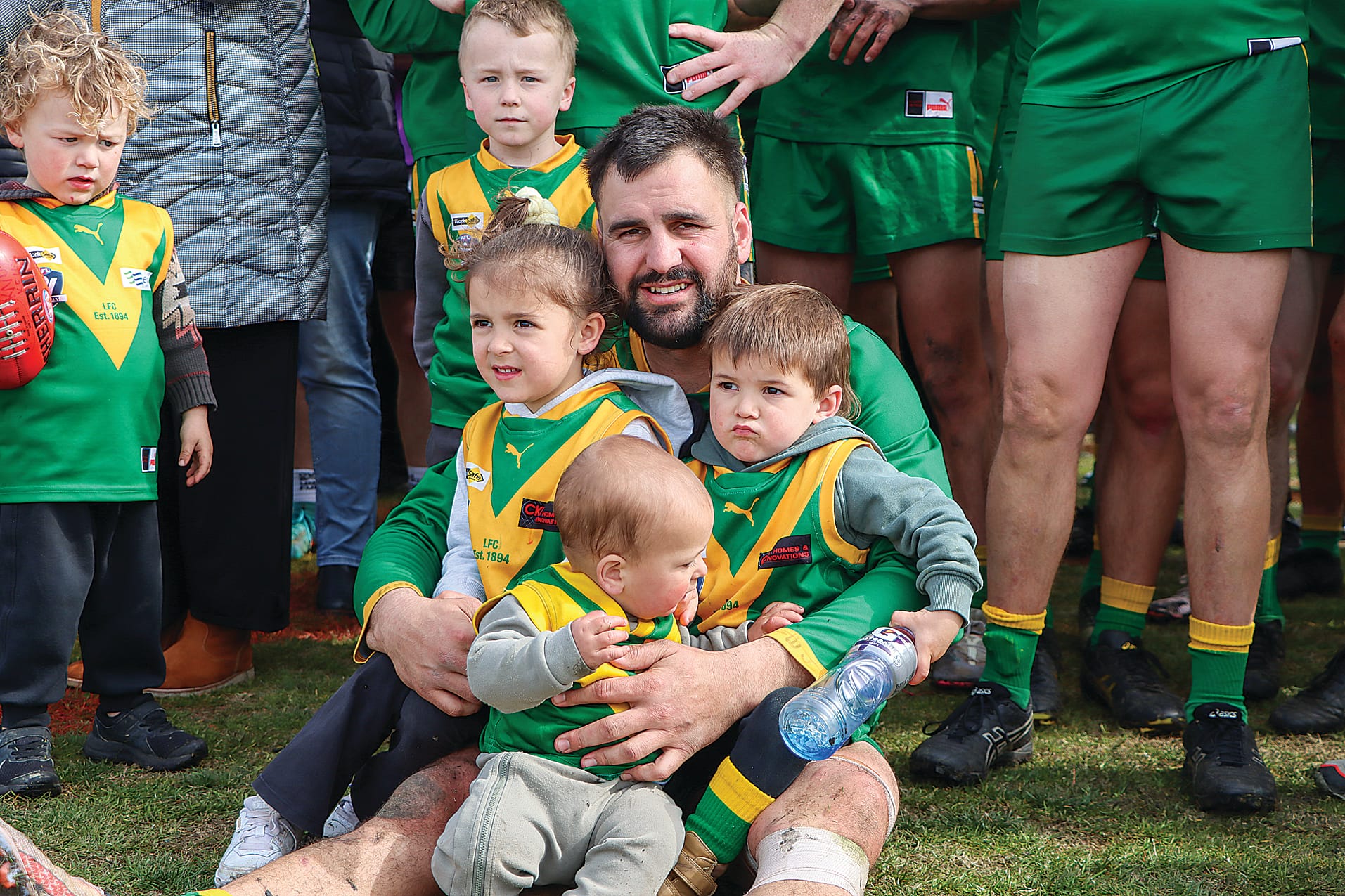 Leongatha’s Justin Pellicano awaits the Reserves premiership presentation with family. A59_3924