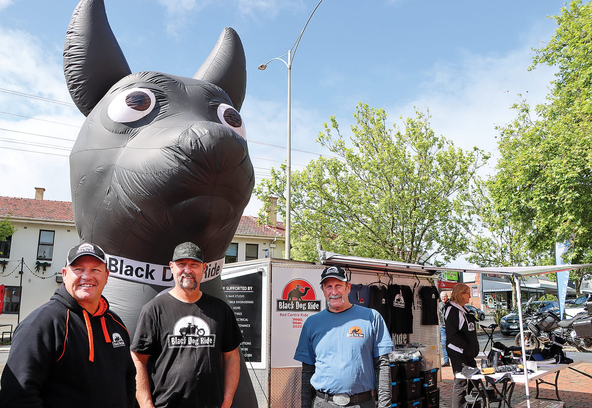 Bernie Garvey, Mark van Leeuwen and Jim Moore of Black Dog Ride with Winston.

