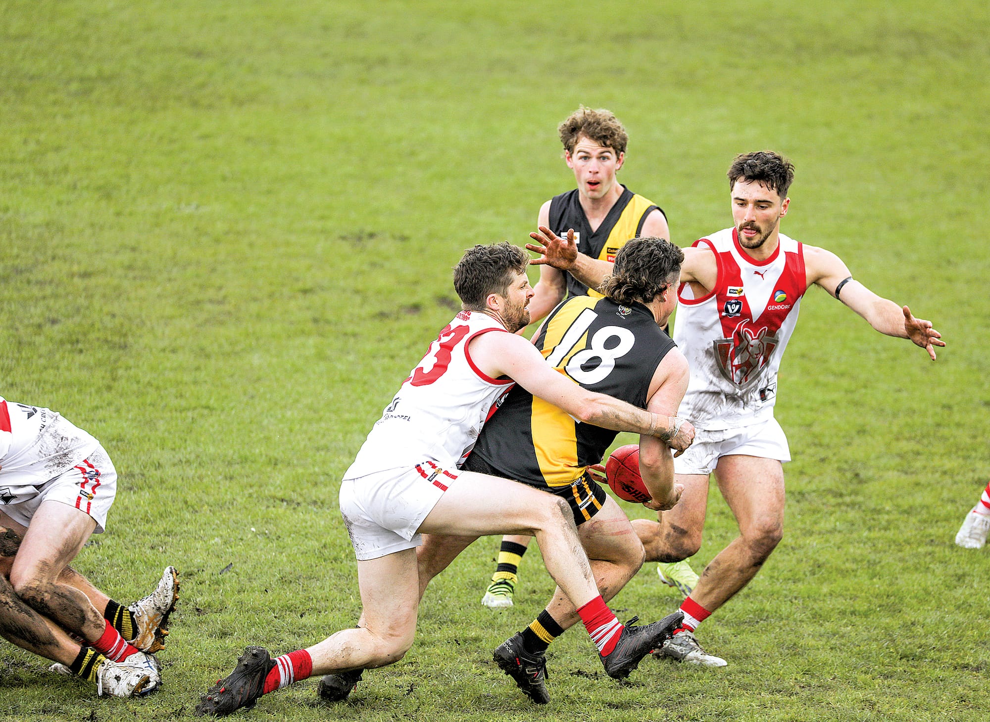 Foster’s Harley Hoppner finds himself in a tight spot as Fish Creek’s Jordan Shaw catches him. A04_3525