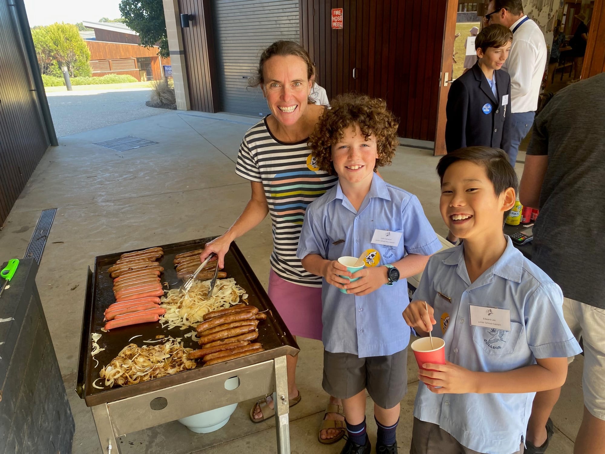 Keeping the barbecue going at the Newhaven College open day was Rachel Cameron with son Leith and another of the day’s guides Edmund Lee.