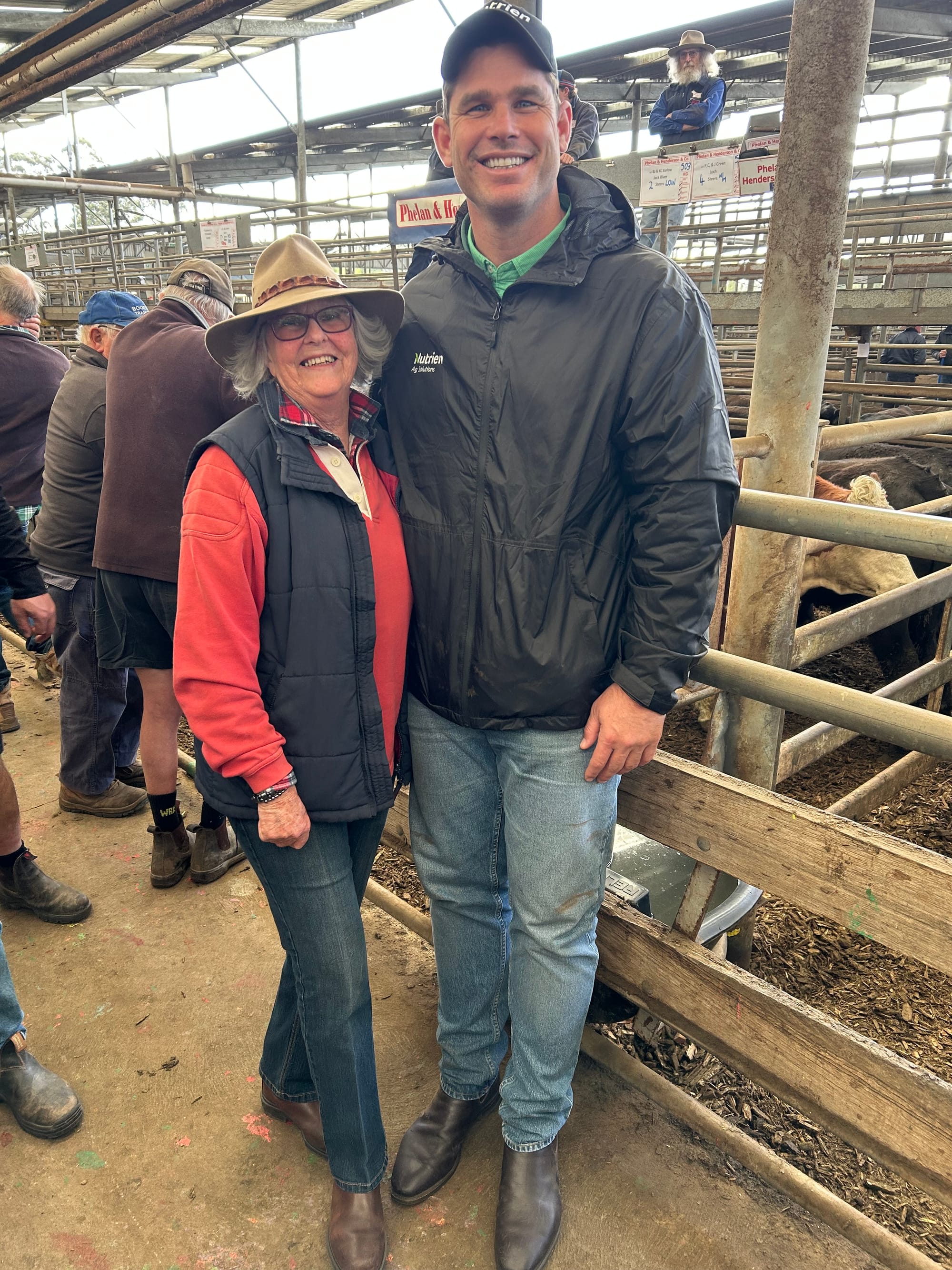 Inverloch farmer and Geelong supporter Louise Brooks is happy to catch up with Tom Hawkins at Thursday’s charity auction at the Leongatha saleyards.