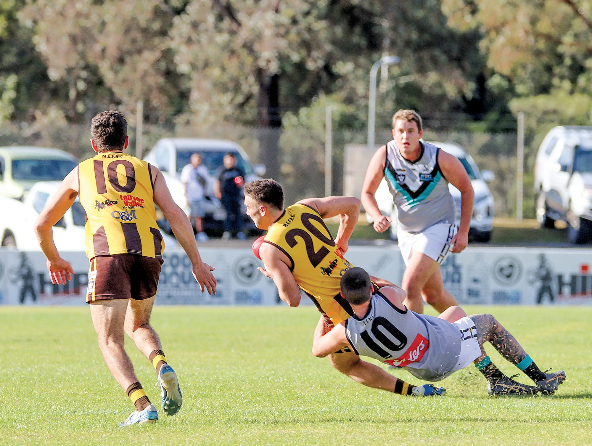 Sam Smart lays a tackle for Toora, having Morwell East’s Jackson Mackenzie in his grasp, the Magpies going on to claim a big win at the Hawks’ nest. A25_2125