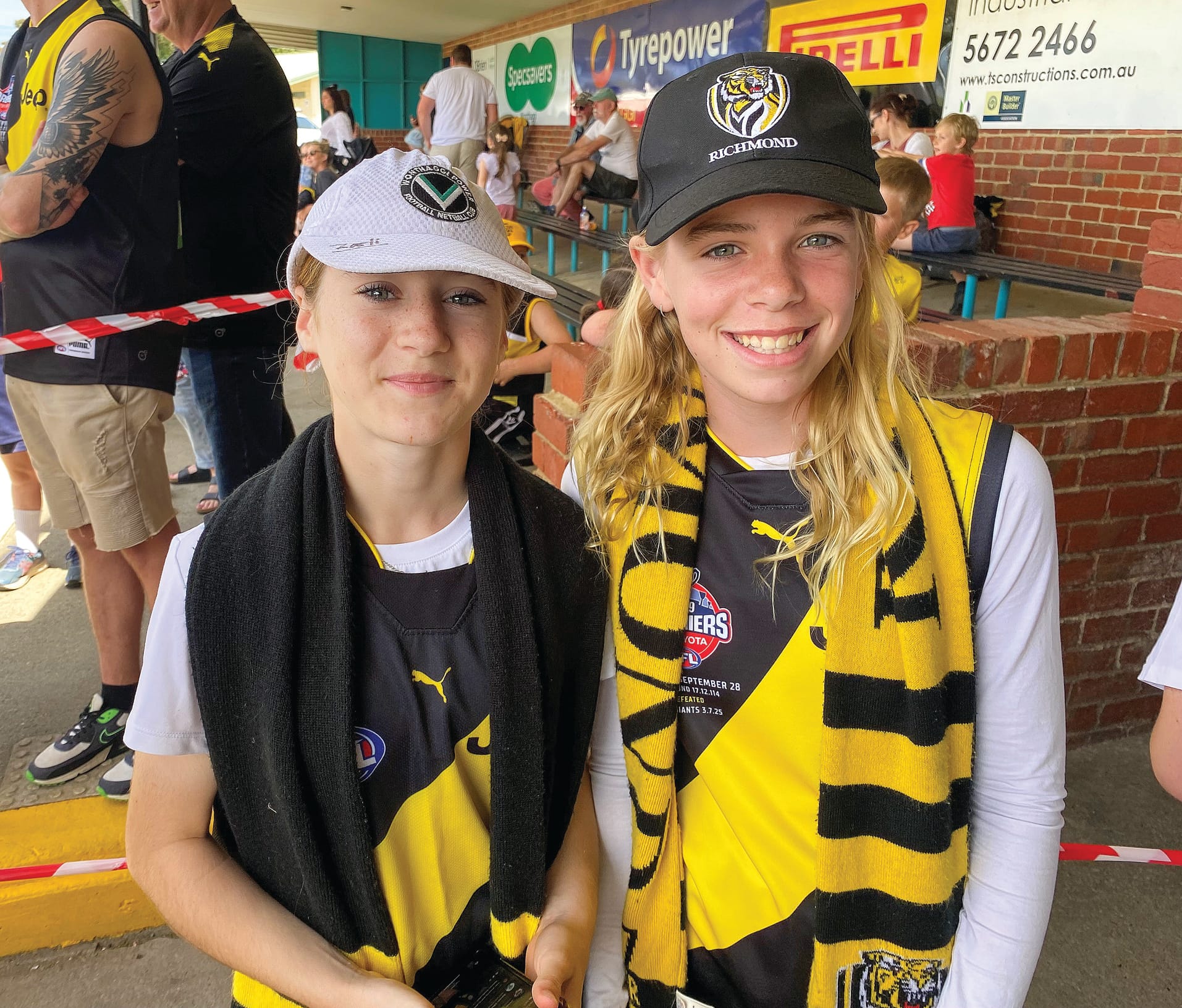 Zali Loughran and Paige Wann waited for their chance to meet the Richmond players.