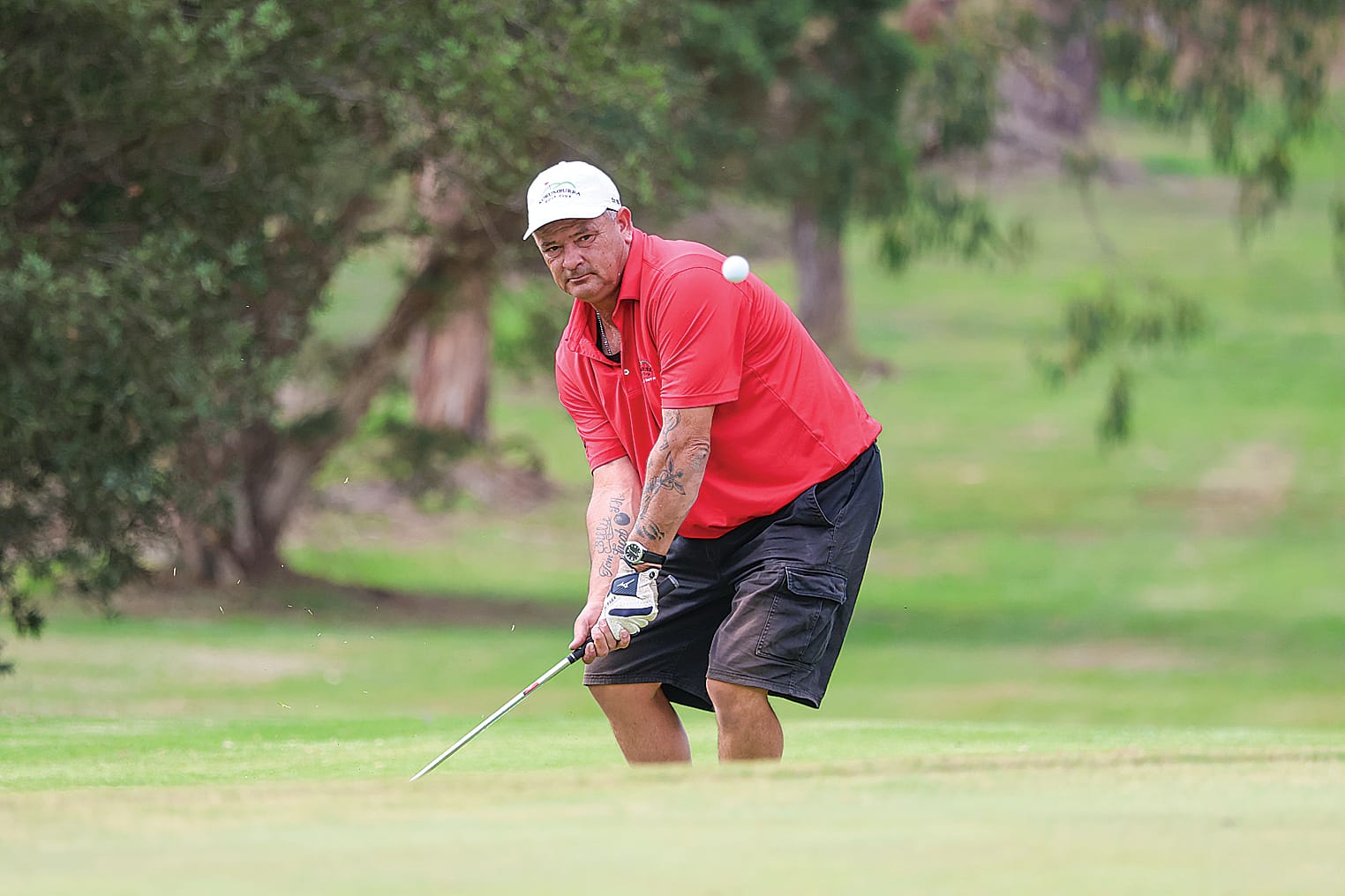 Korumburra’s Matt Wrigley chips up onto the 16th green hoping to keep his match against Woorayl’s Damien Symmons alive.