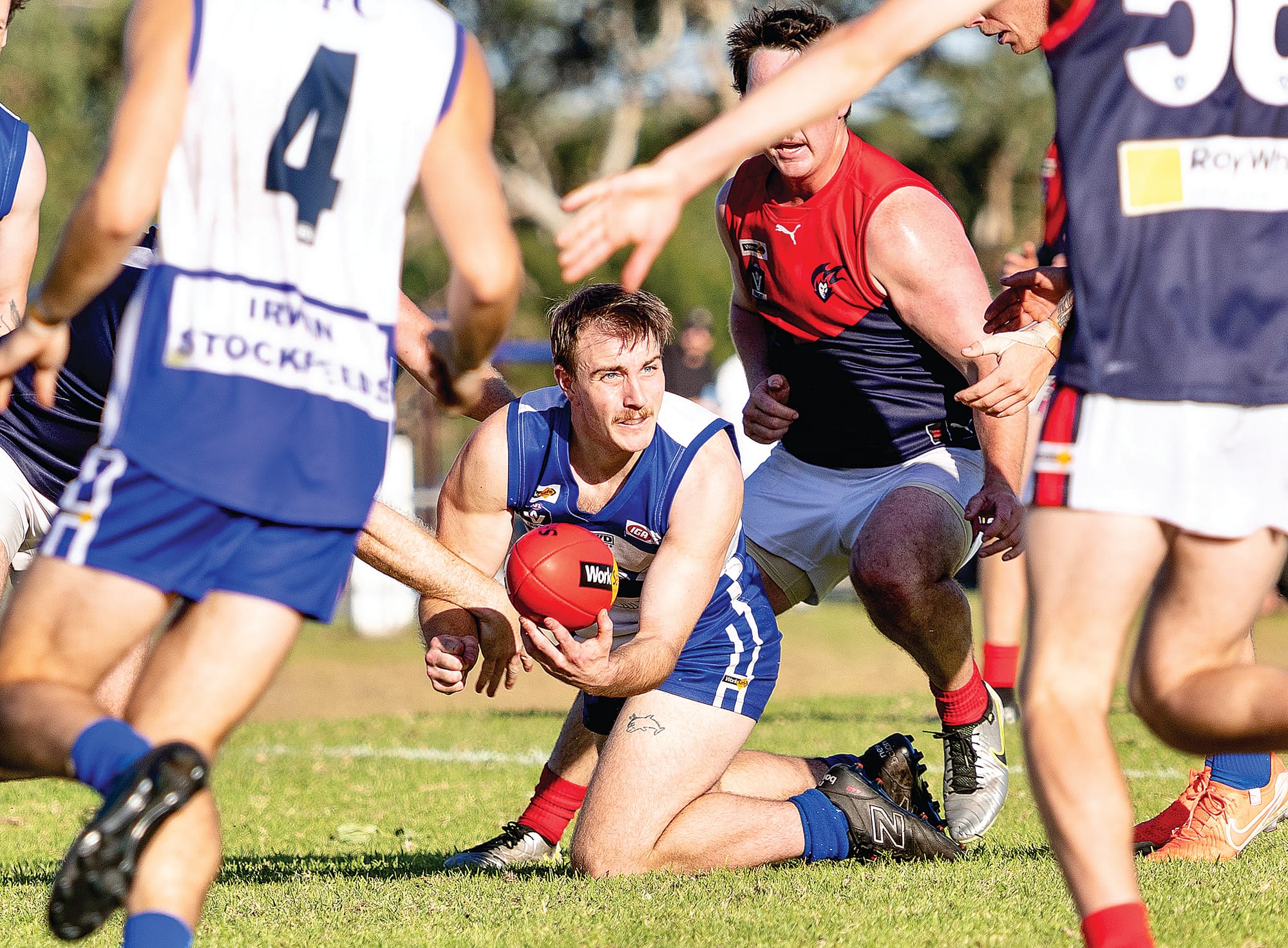 Tom Van der Kolk looks for an opening for the handpass and his opponents surround him. Photos: Bec Casey Sports Photography.