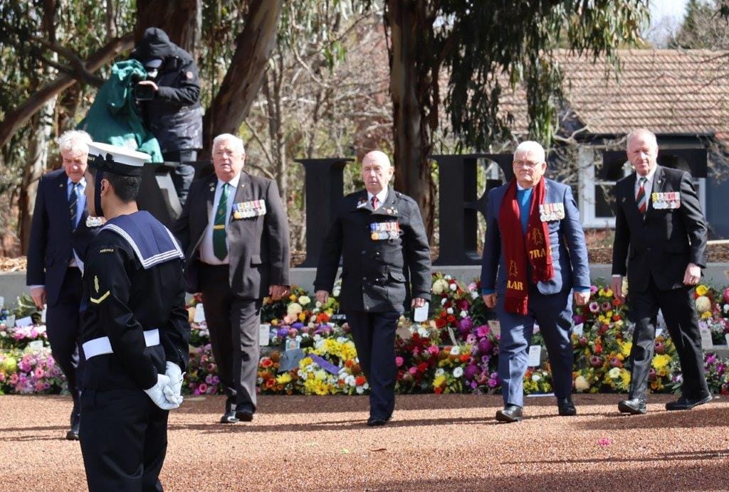 Vietnam Veterans, members of 7RAR lay a wreath at the Vietnam Veterans Memorial in Canberra.

