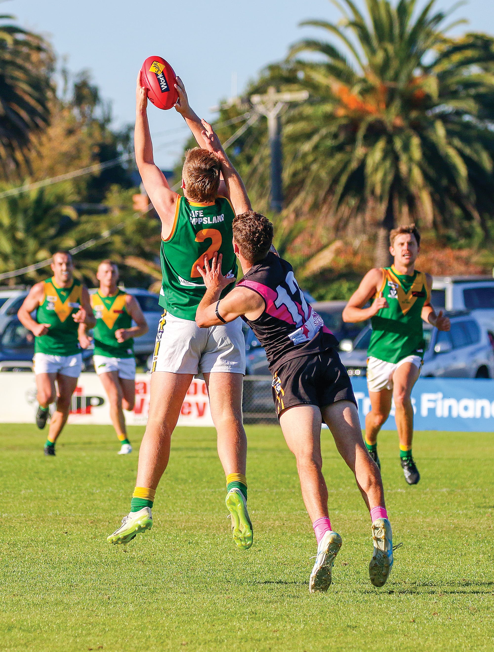 Jenson Garnham leaps to take the mark before kicking it through for a goal. ob34_1925