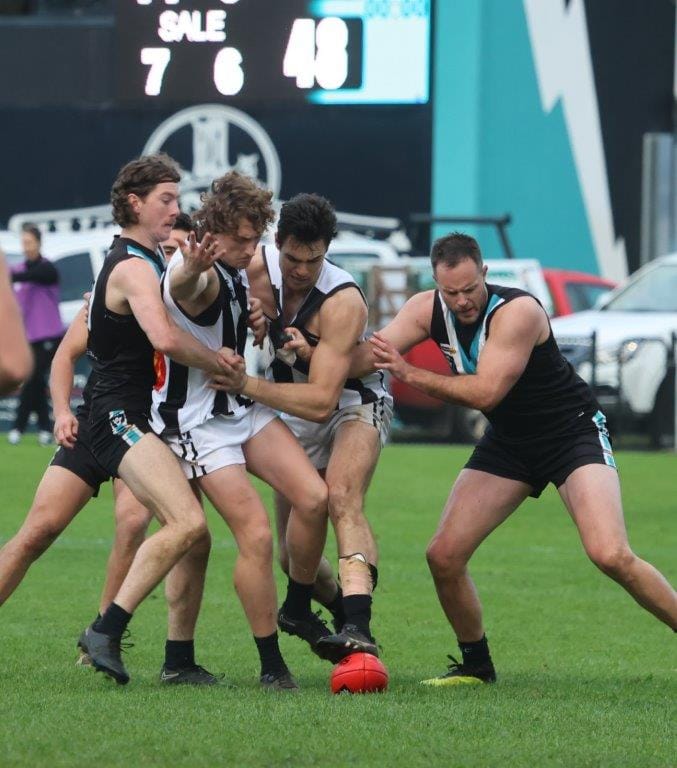 Ex-Collingwood premiership player Nathan Brown gets into the thick of it during a winning start with Wonthaggi against Sale on Saturday.