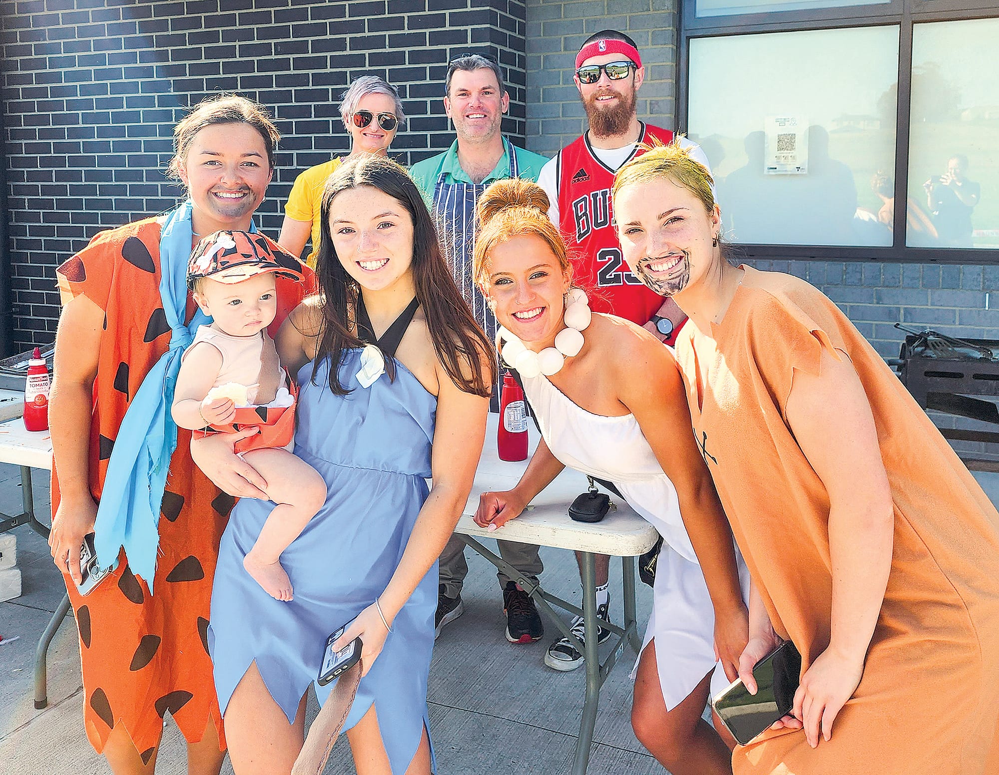 The Flintstones were represented vehicle and all by Kirra, (baby) Isabella, Leah, Freya and Tilly as they posed with teachers Gemma, Alistair and Jim. C26_4322