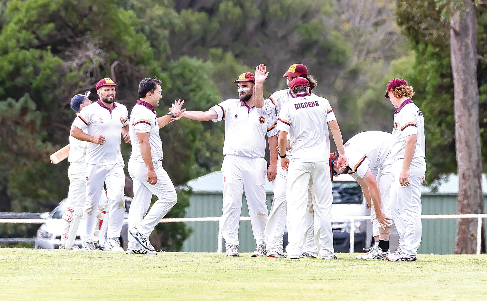 A pivotal point in the Grand Final where Tommy Wyatt is being congratulated for dismissing Island top scorer Brodie Johnston. Photo: Peter Cleeland.