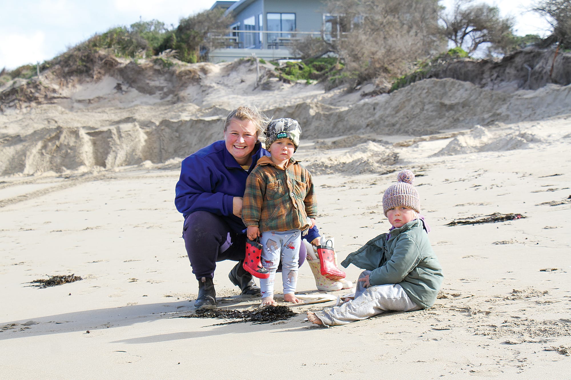 Bechet, Chase and Evie playing on the beach at the Inverloch SLSC after Bass Coast Council replaced sand scoured from the ends of the geotextile sand bag wall. B13_2325
