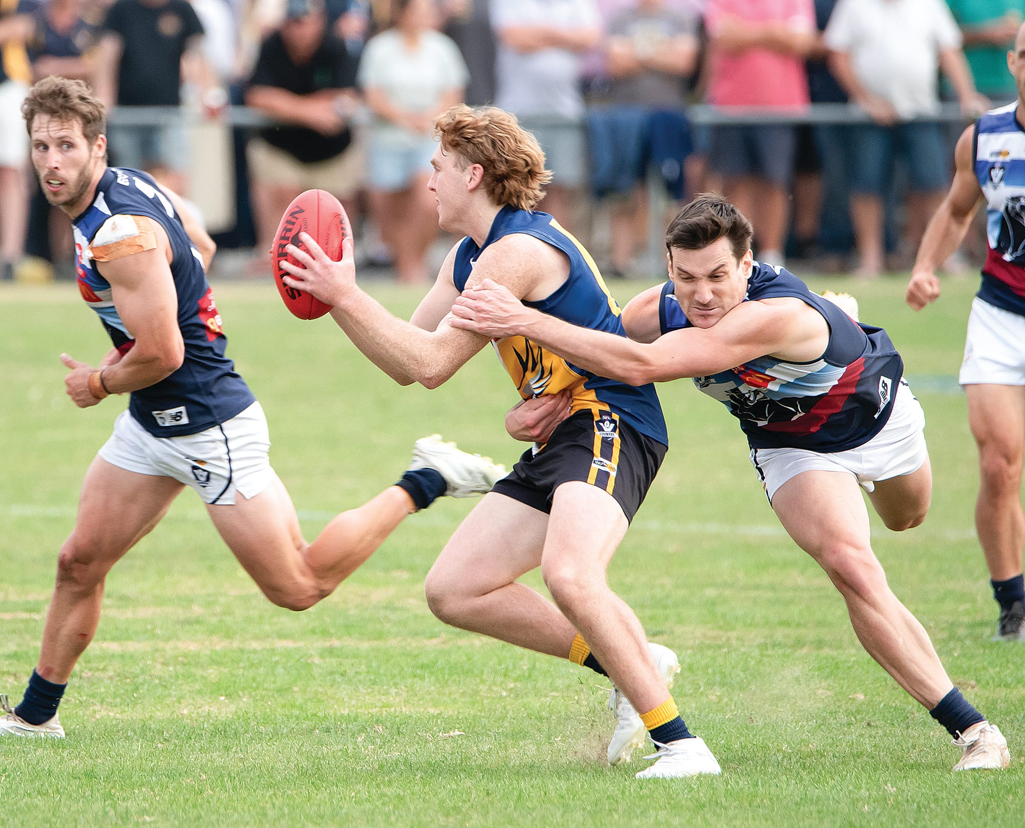 Zak Box takes possession of the footy for IK, as Joseph West applies pressure for Kilcunda Bass. Photos: Anna Carson