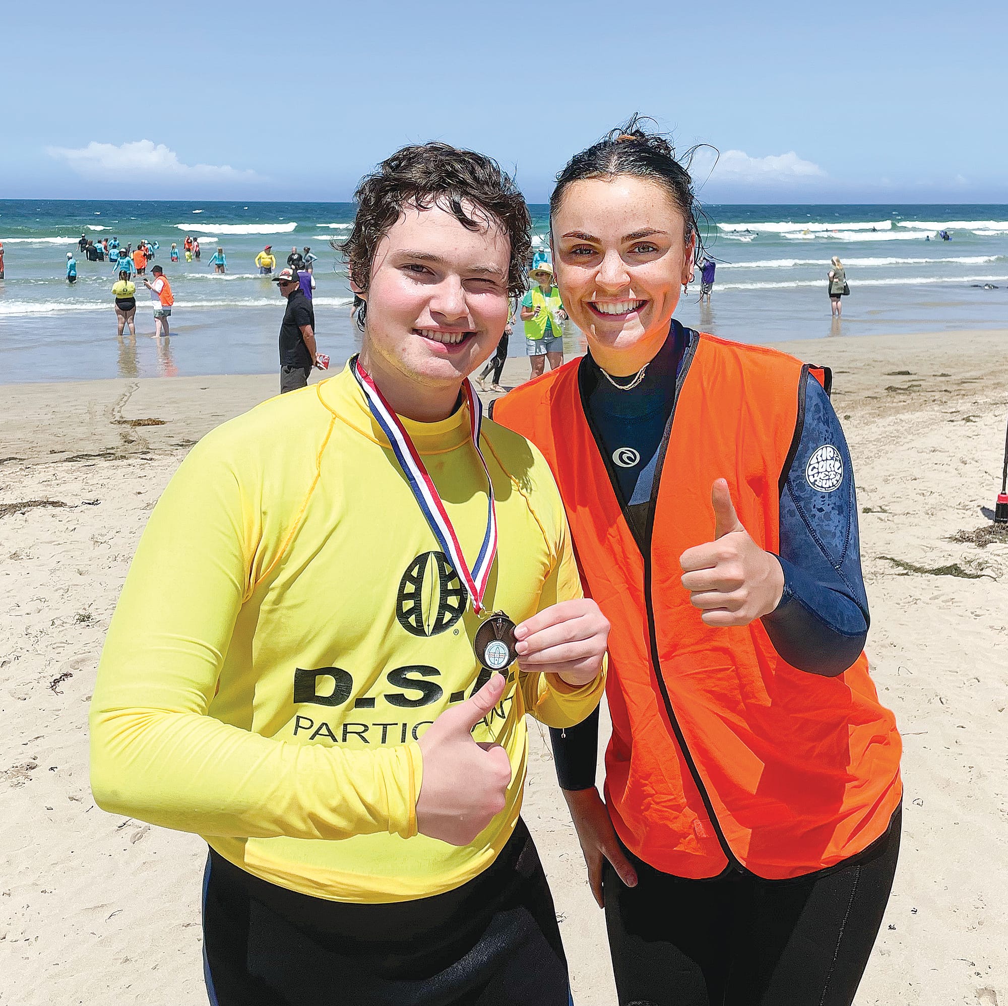 Coby Saul displays his all abilities surfing medal, with his support worker Meg Preston. A29_0423
