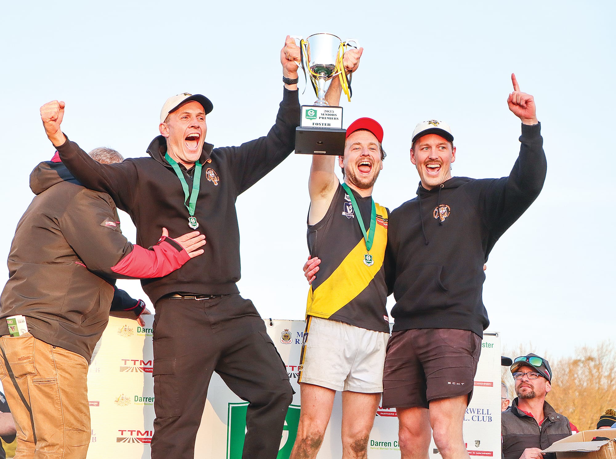 Foster coach Sam Davies and captain Dylan Williams raise the Premiership Cup. A26_3725