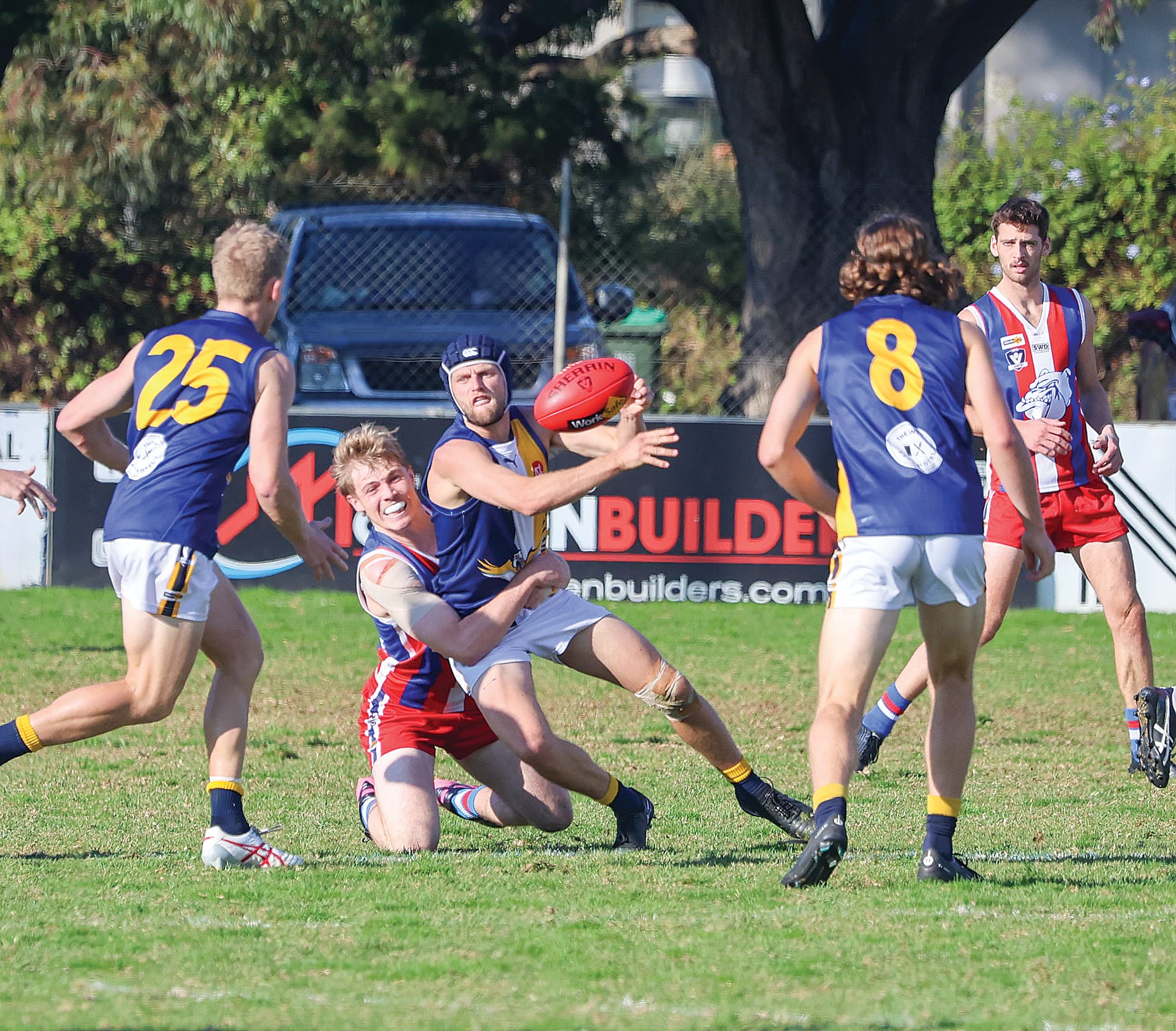 IK onballer Will Hams is taken in a tackle by Phillip Island counterpart Charlie Bruce as the Island gets on top early in the match of the day in West Gippsland.