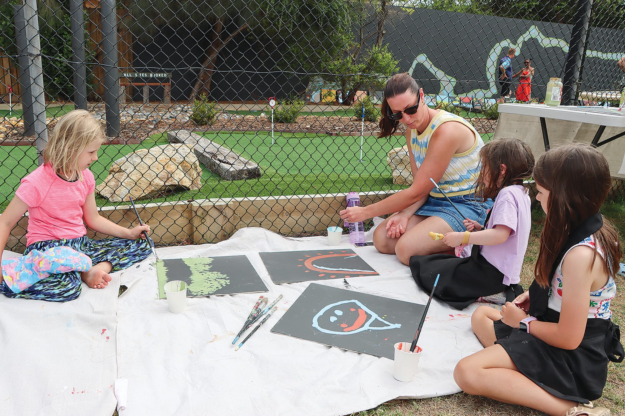 Goldie Grieve of Caulfield and Libby, Anita and Imogen Hayes of Frankston enjoy the art session. A08_0225