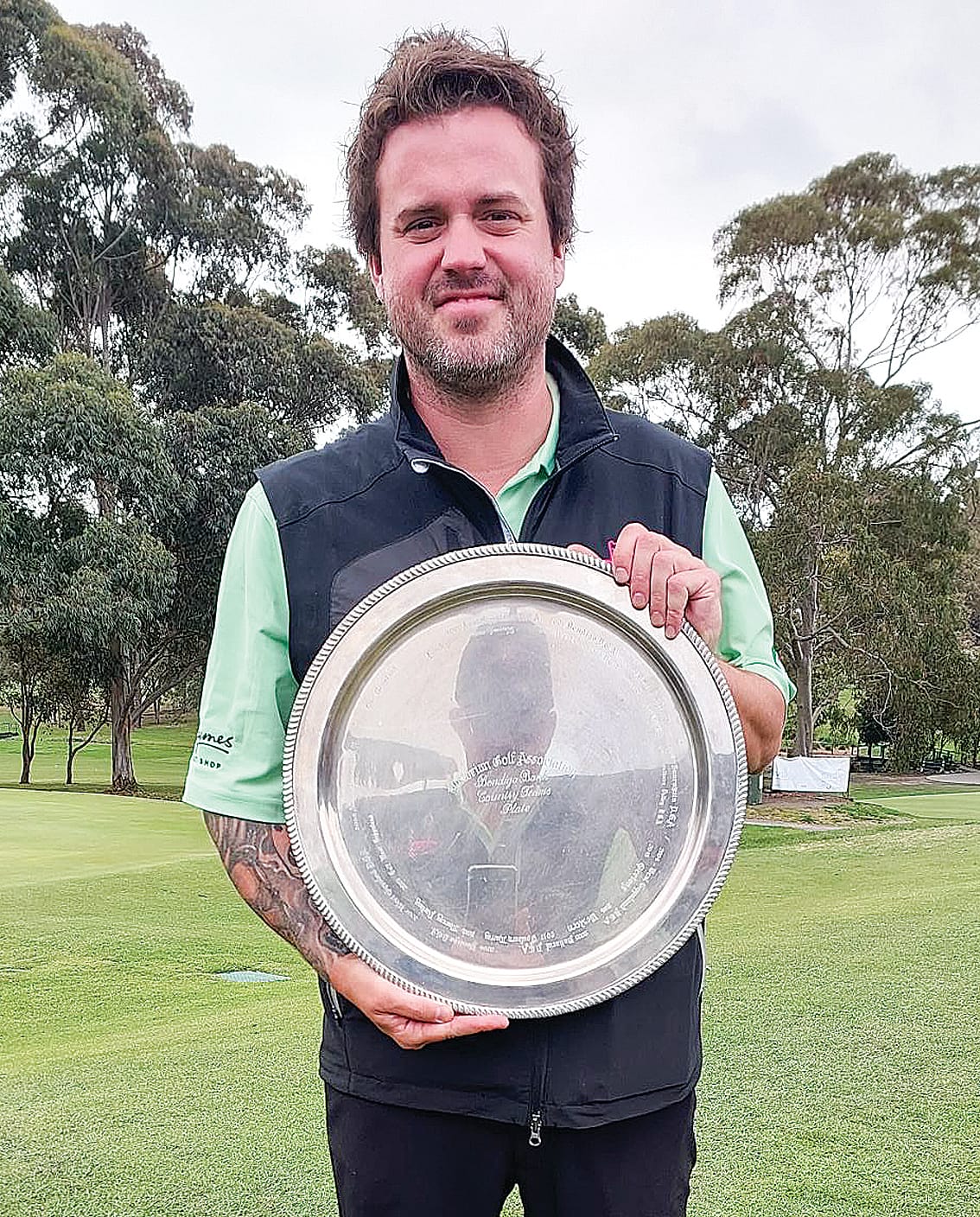 Captain of Korumburra Steve Bromby with the Bendigo Bank Country Teams Plate. 