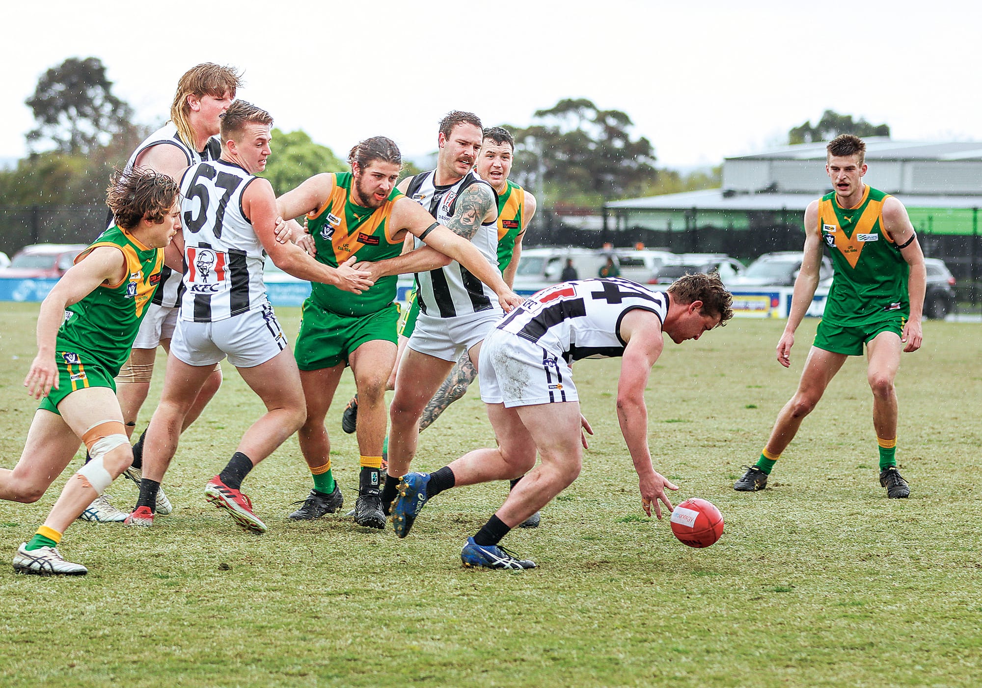 Players gravitate to the footy during the reserves grand final.