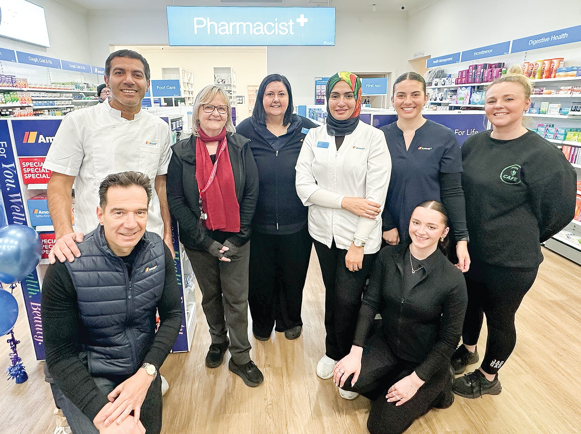 Co-owners of Nyora Amcal Pharmacy Sam Shalabi and George Spyropoulos (front) celebrate the official opening, with all the hub staff, Carol Atkinson, Vicki Warne, Amira Darwish, Amber Parkinson (front), Sheridan Stone and Bek Zealley. 