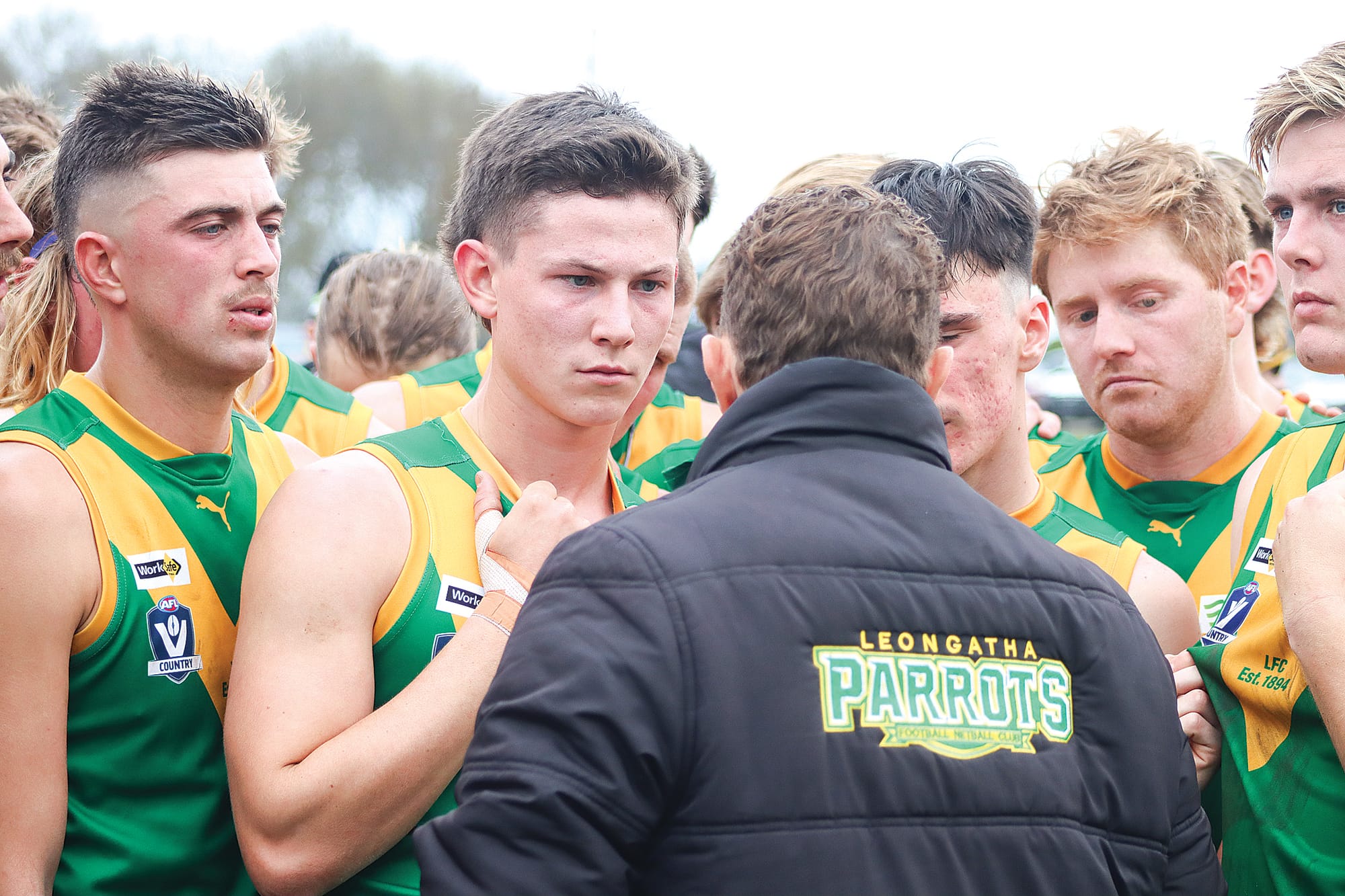 Leongatha coach Trent McMicking has his players’ attention in the huddle on the way to a big win over Drouin. A11_2424