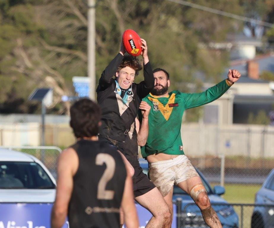 Wonthaggi’s Isaac Chugg marks in front of Leongatha forward Justin Pellicano during a masterful display of back play.