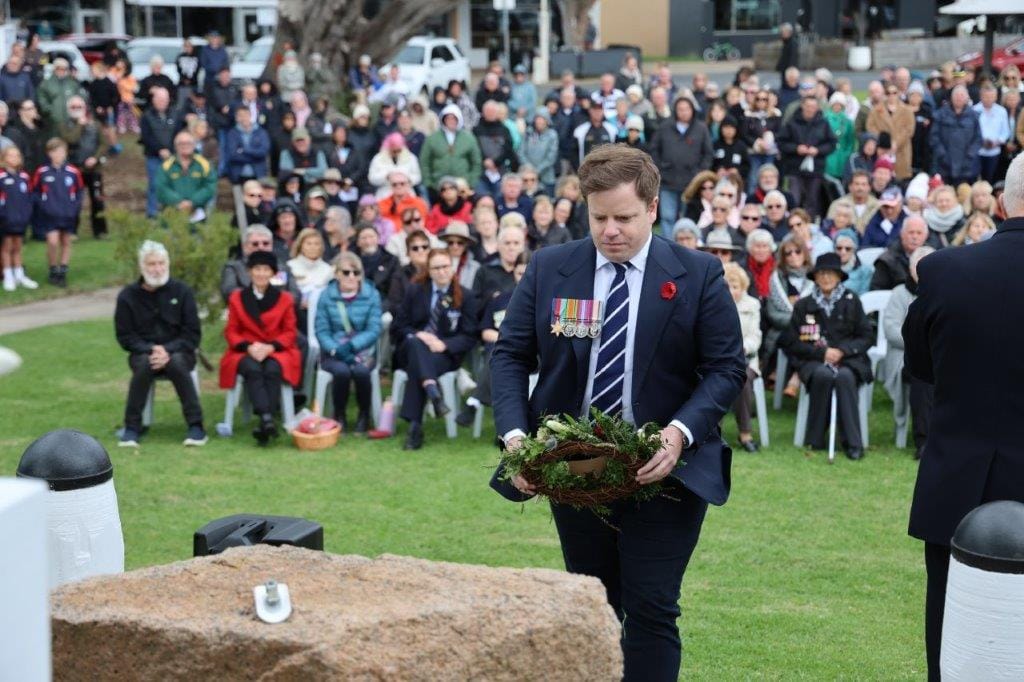 Tully Fletcher lays a wreath on behalf of Bass MP Jordan Crugnale at San Remo on Anzac Day.