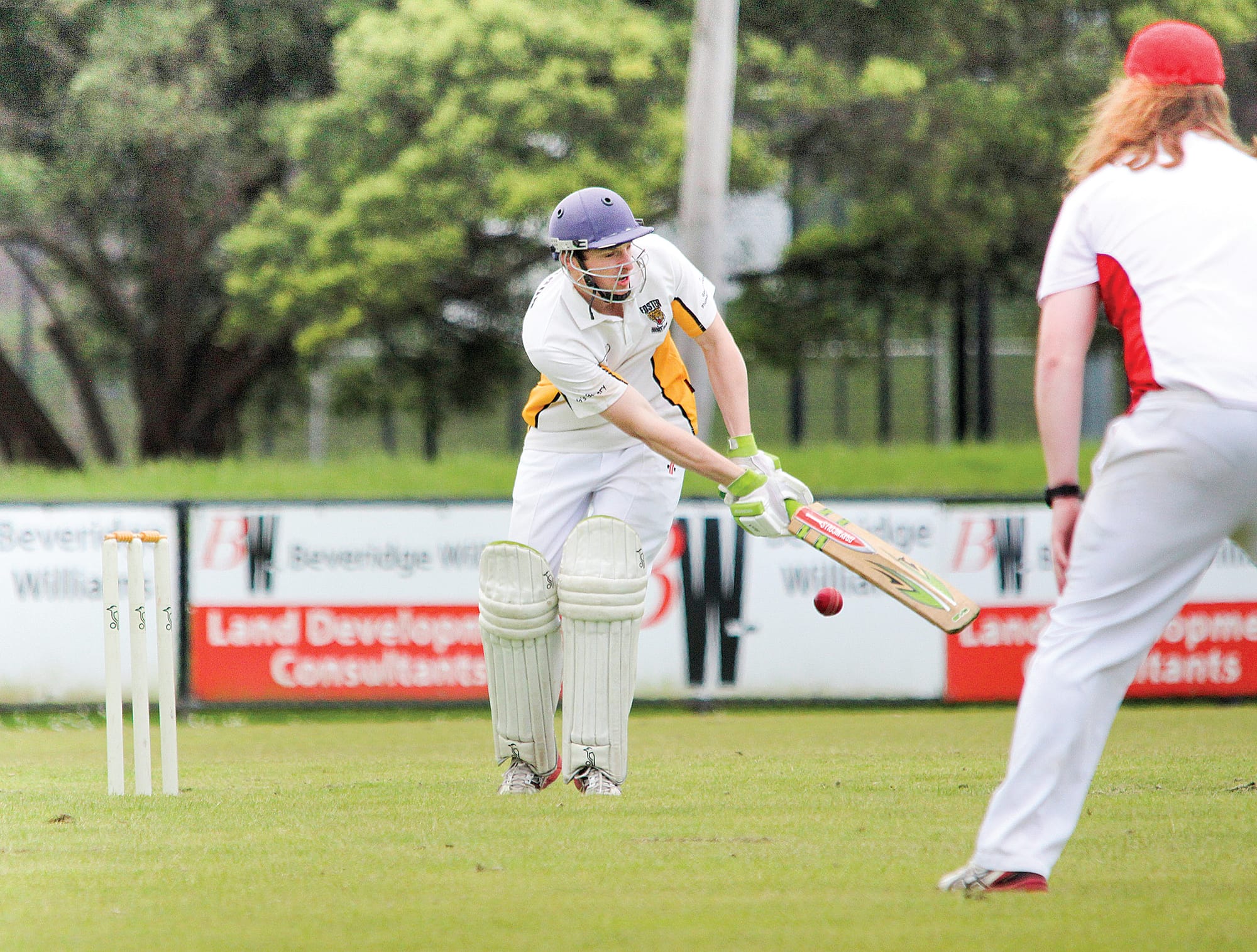 Andrew Pattie clips one off his legs. 