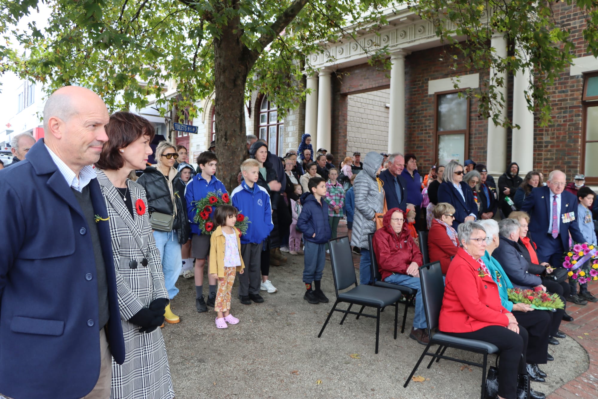 Leongatha locals and visitors pay their respects outside the town’s Memorial Hall.