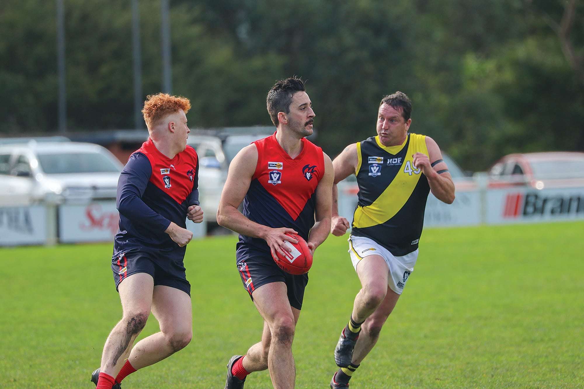 Rhys Fisher goes for goal with Mirboo North on his tail. Z28_2924 