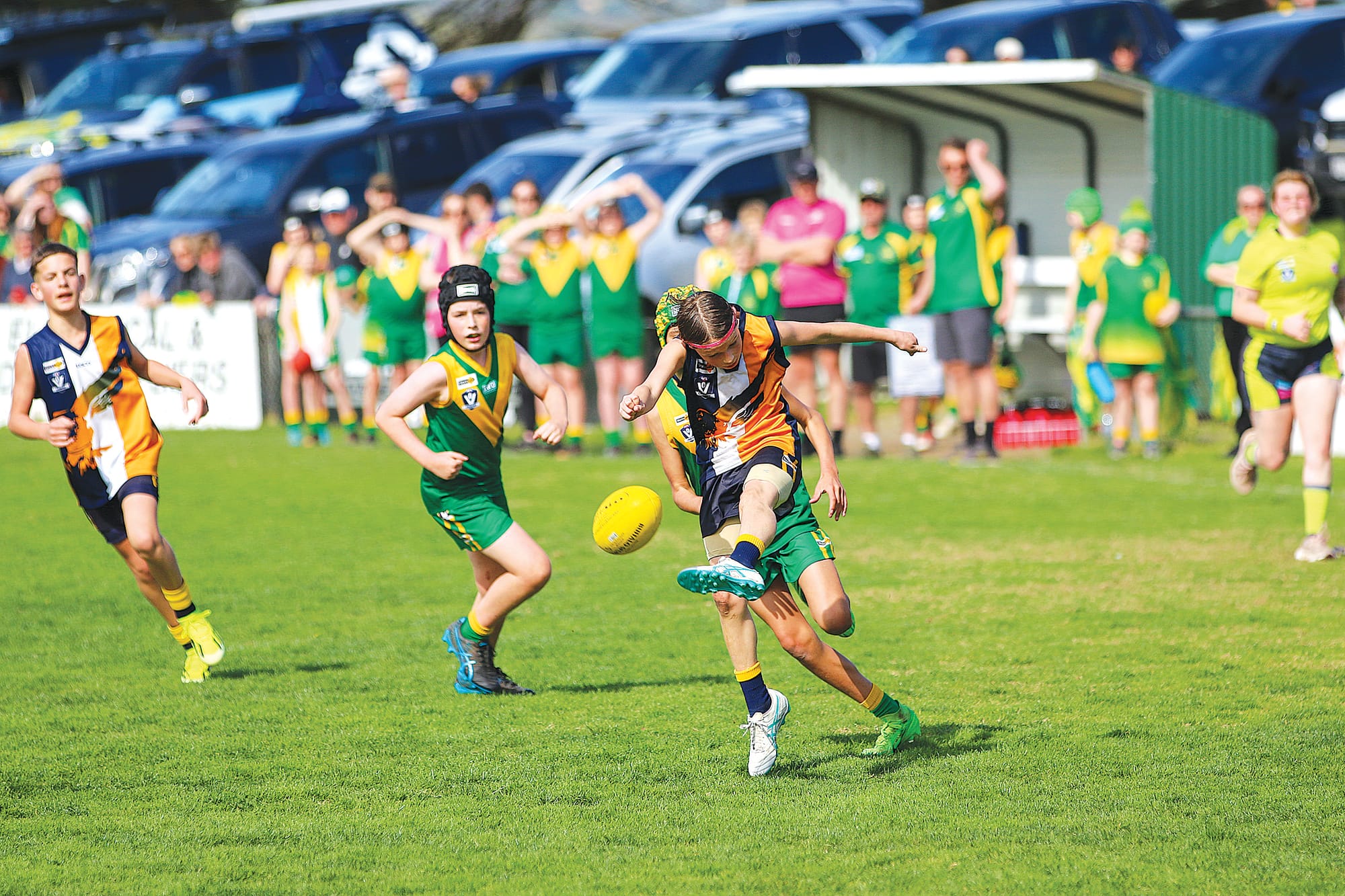 Inverloch-Kongwak’s Wilco Stubbs gets the ball out of danger in the U12 mixed grand final.