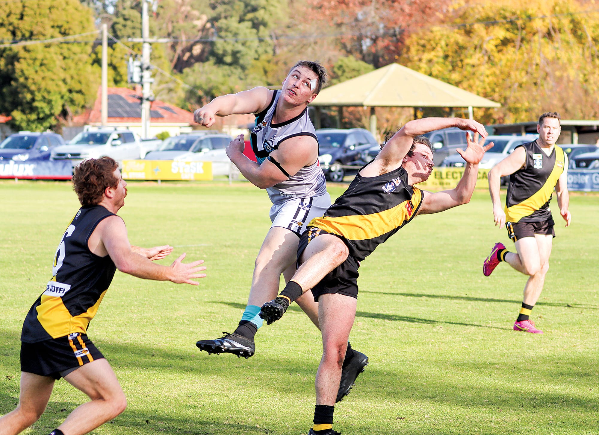 Toora and Foster find a moment to engage in an interpretive dance during the opening quarter, the ball’s whereabouts a mystery. A14_2425