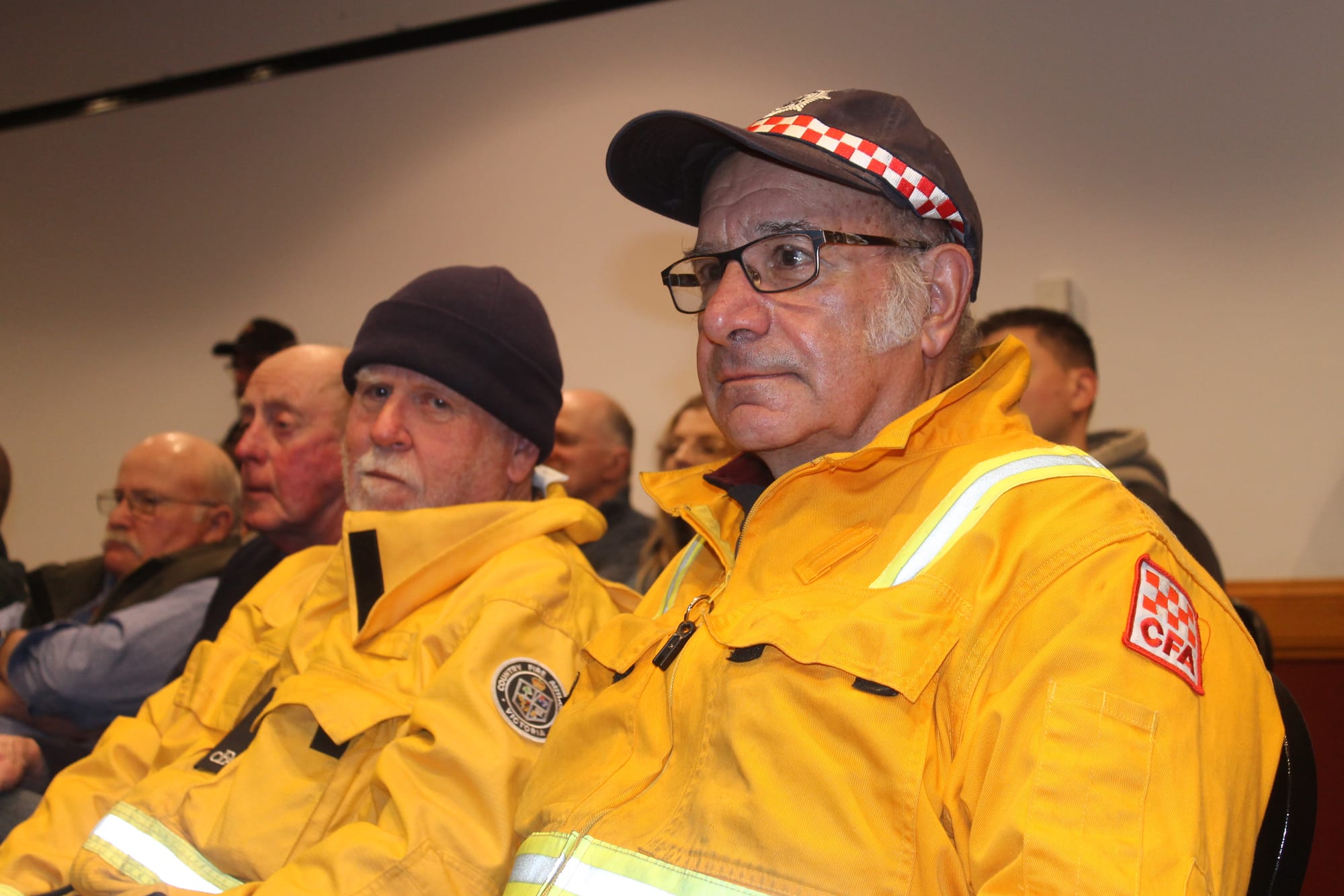 Fish Creek CFA Captain Ray Poletti and Secretary Mike O'Mara attending the Not in Our Name rally at the Wonthaggi Workmen's Club. B06_3425